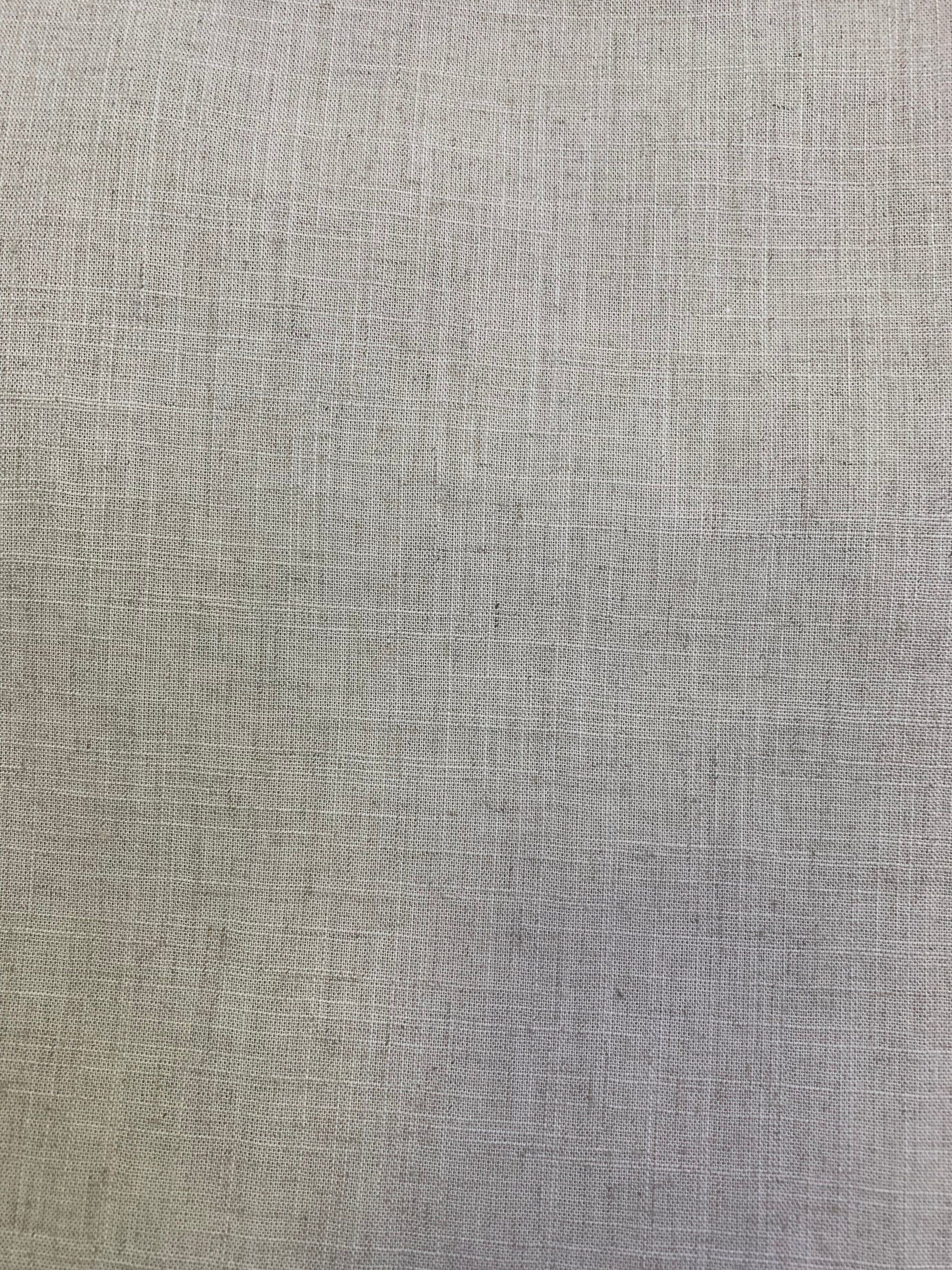 A detailed view of natural coloured viscose linen deadstock fabric in a neutral tone.