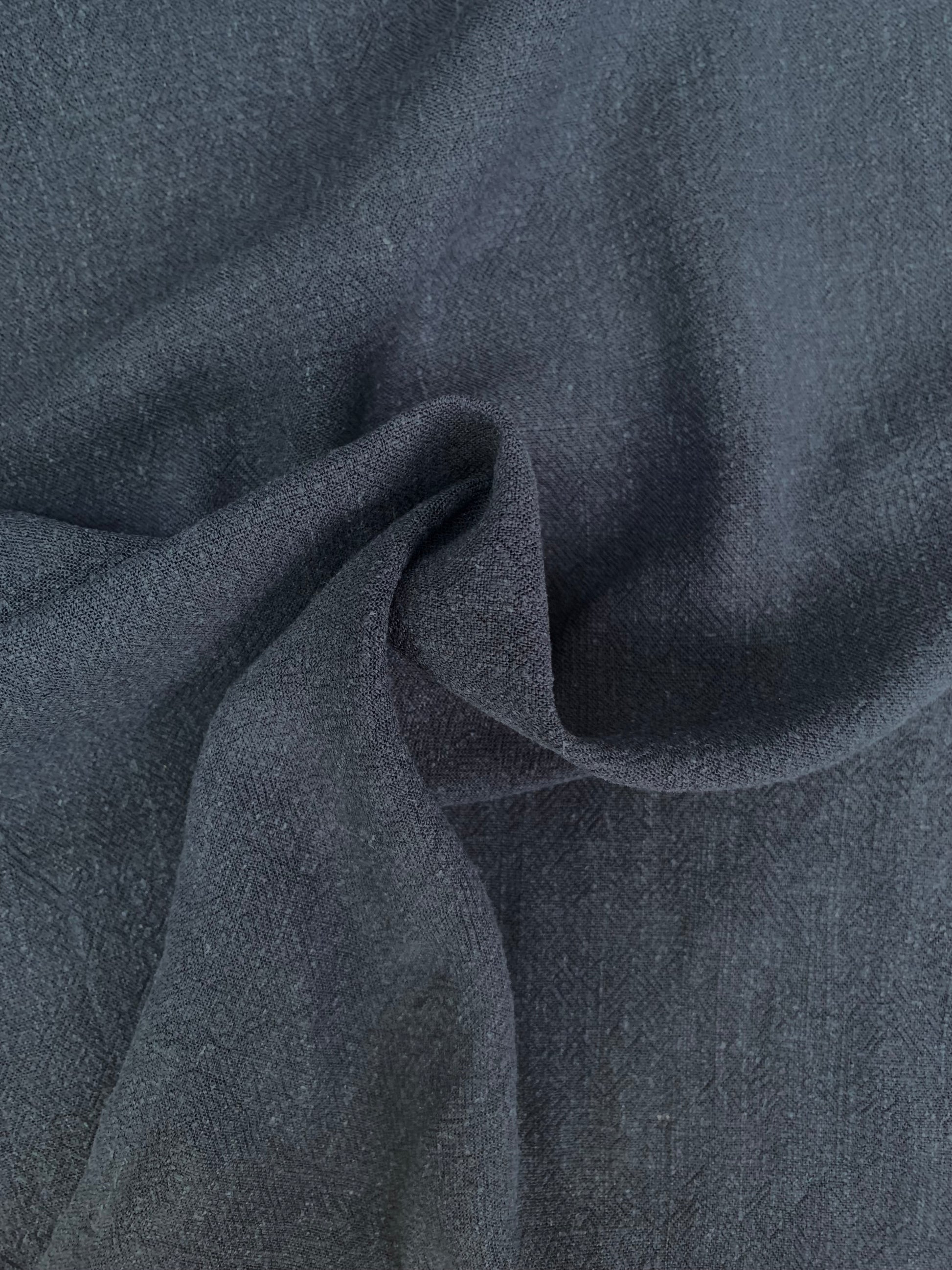 Navy sand-washed fabric shown in soft folded close-up.