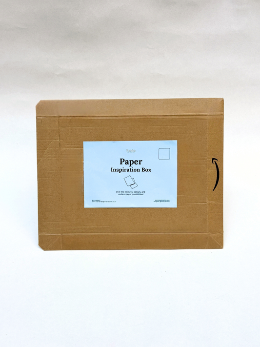 Brown cardboard box with a blue label on a white background