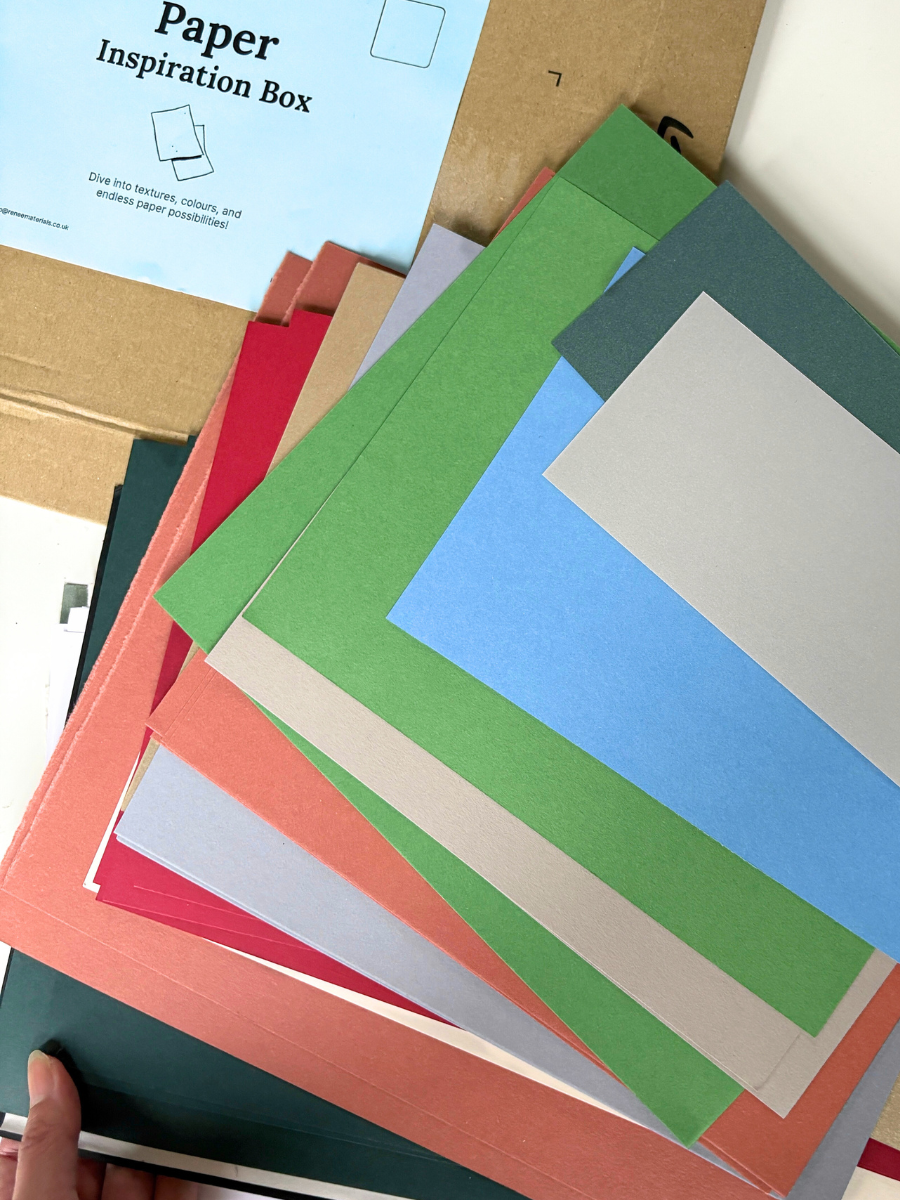Stack of colorful paper sheets with a 'Paper Inspiration Box' label.