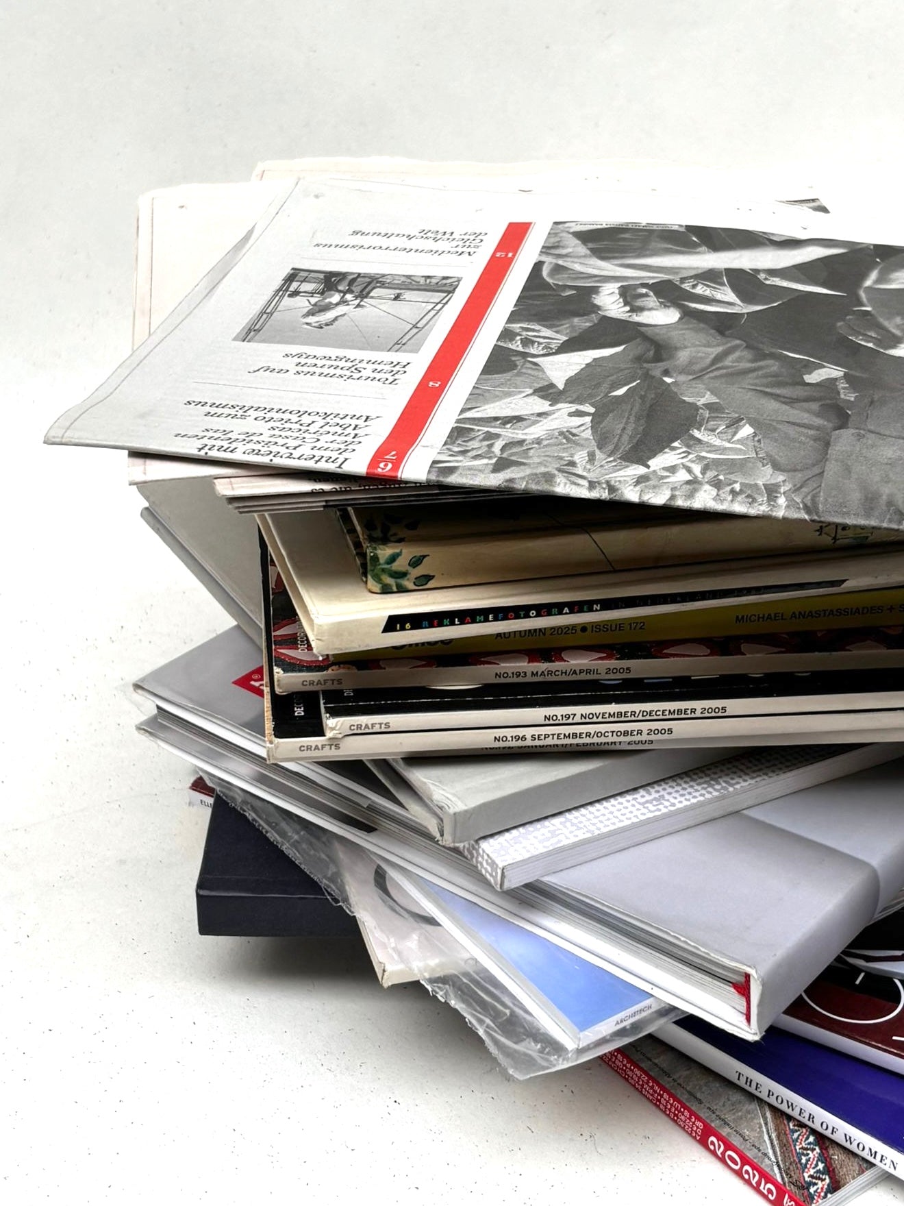 Printed materials are shown in detail with stacked edges and covers