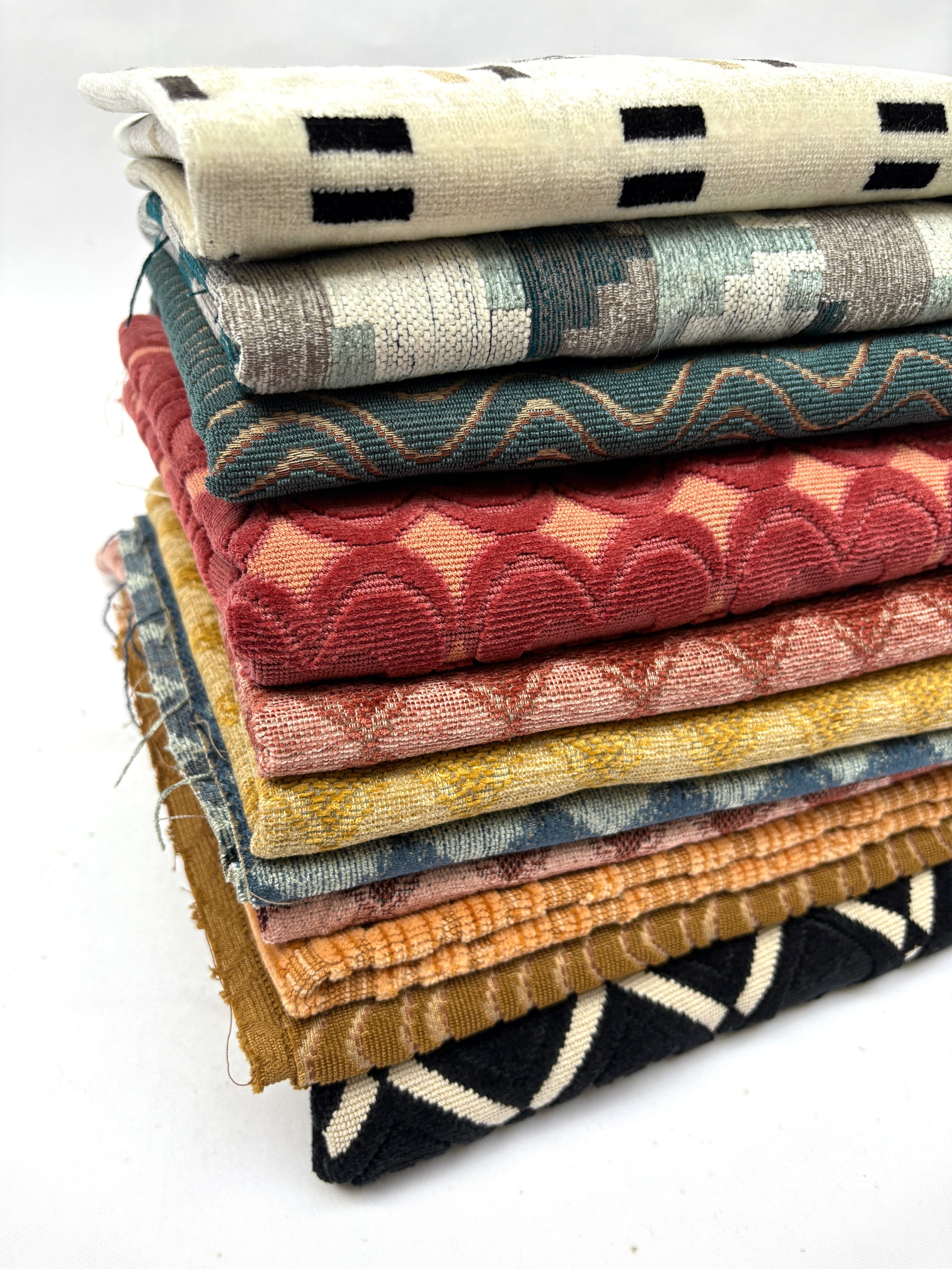 Stack of patterned fabric with various colours 