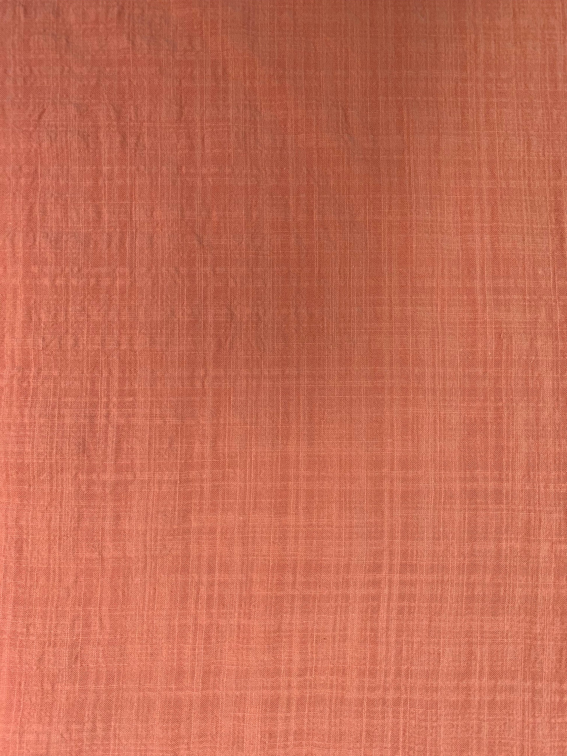 A detailed fabric shot highlighting the peach check and subtle texture.