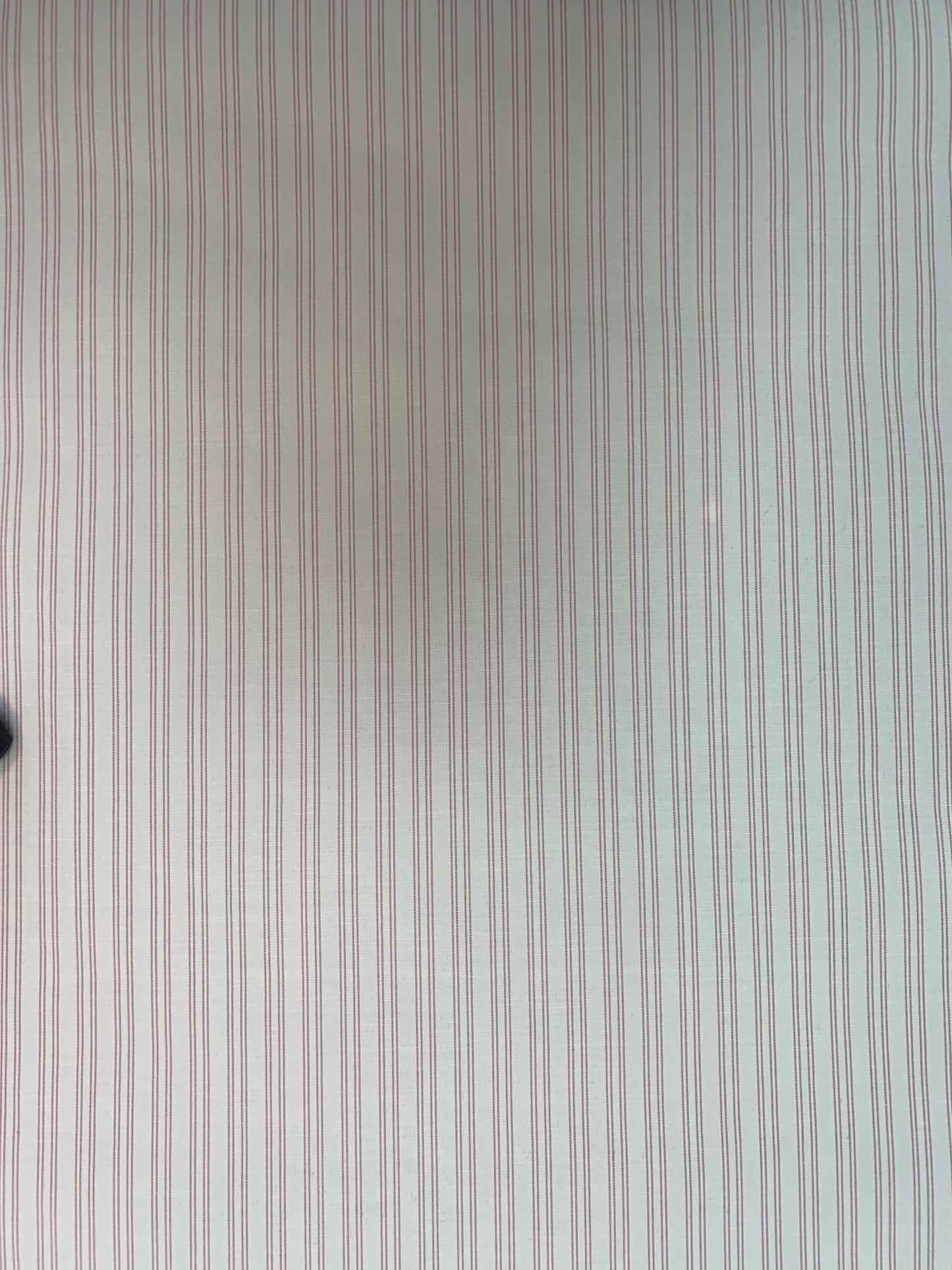 A flat close-up highlighting the spacing of the pink-white double stripes.