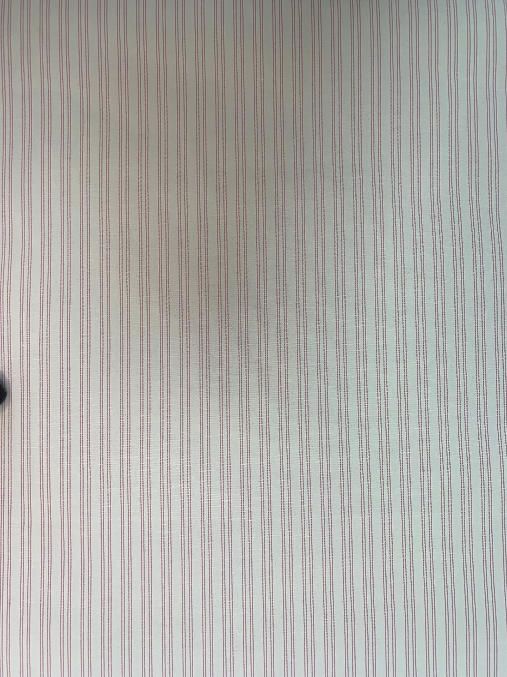 A flat close-up highlighting the spacing of the pink-white double stripes.