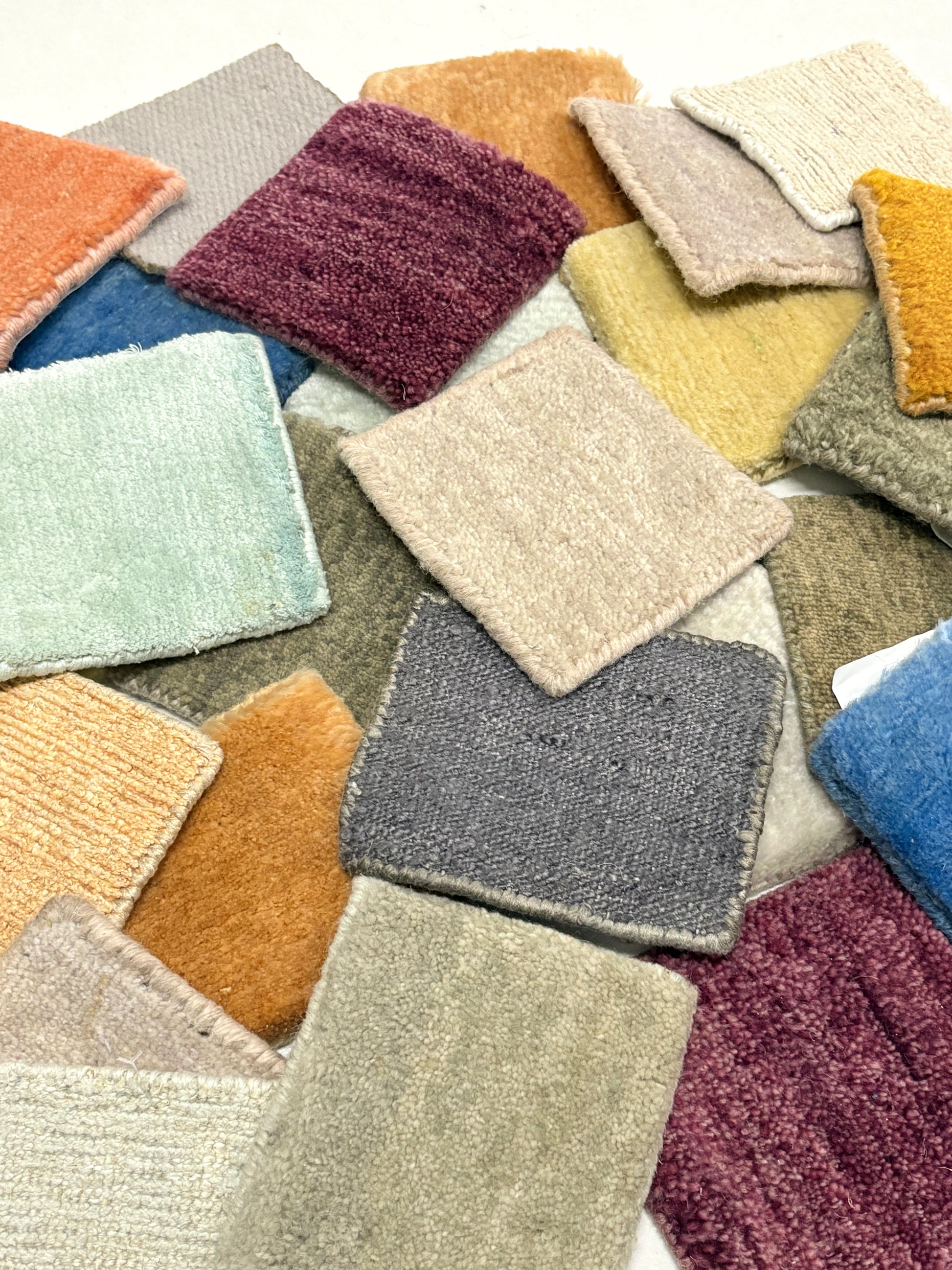 Assorted velvet fabric swatches in mixed colours and plush textures.