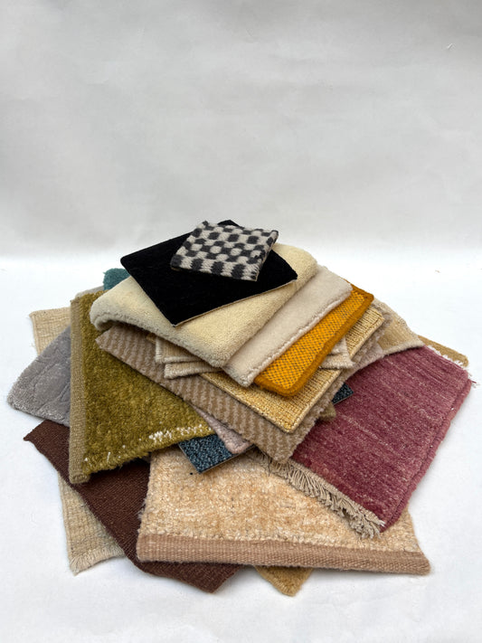 Mixed fabric and surface samples are stacked on a white background