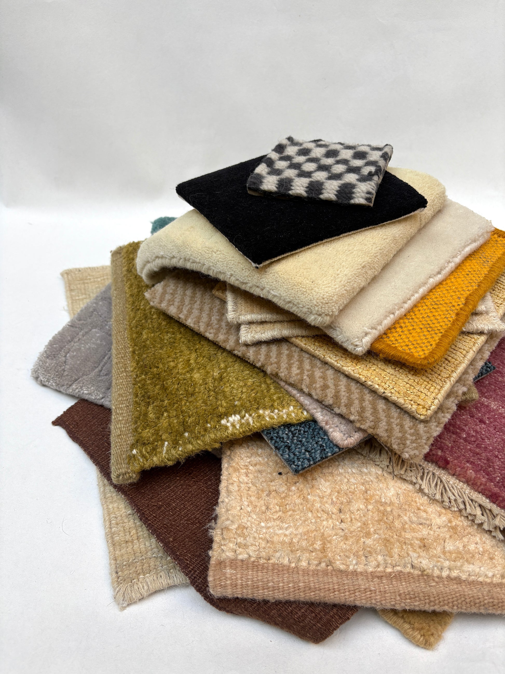 Small sample swatches are arranged in stacked and spread-out groups