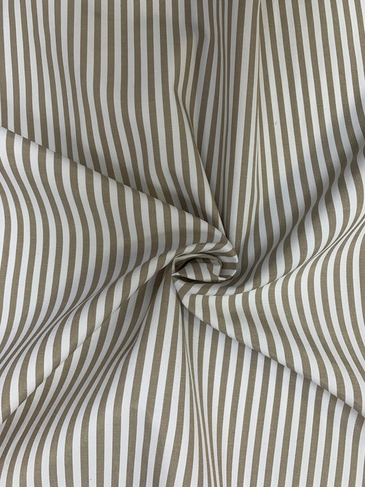 Close detail of stone-white stripe shirting gathered in gentle folds.