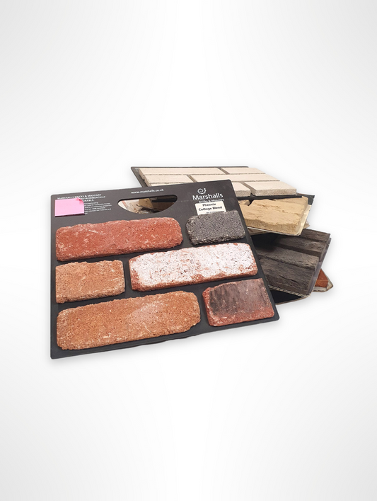 Mixed brick and paving sample boards displayed against a plain light background.