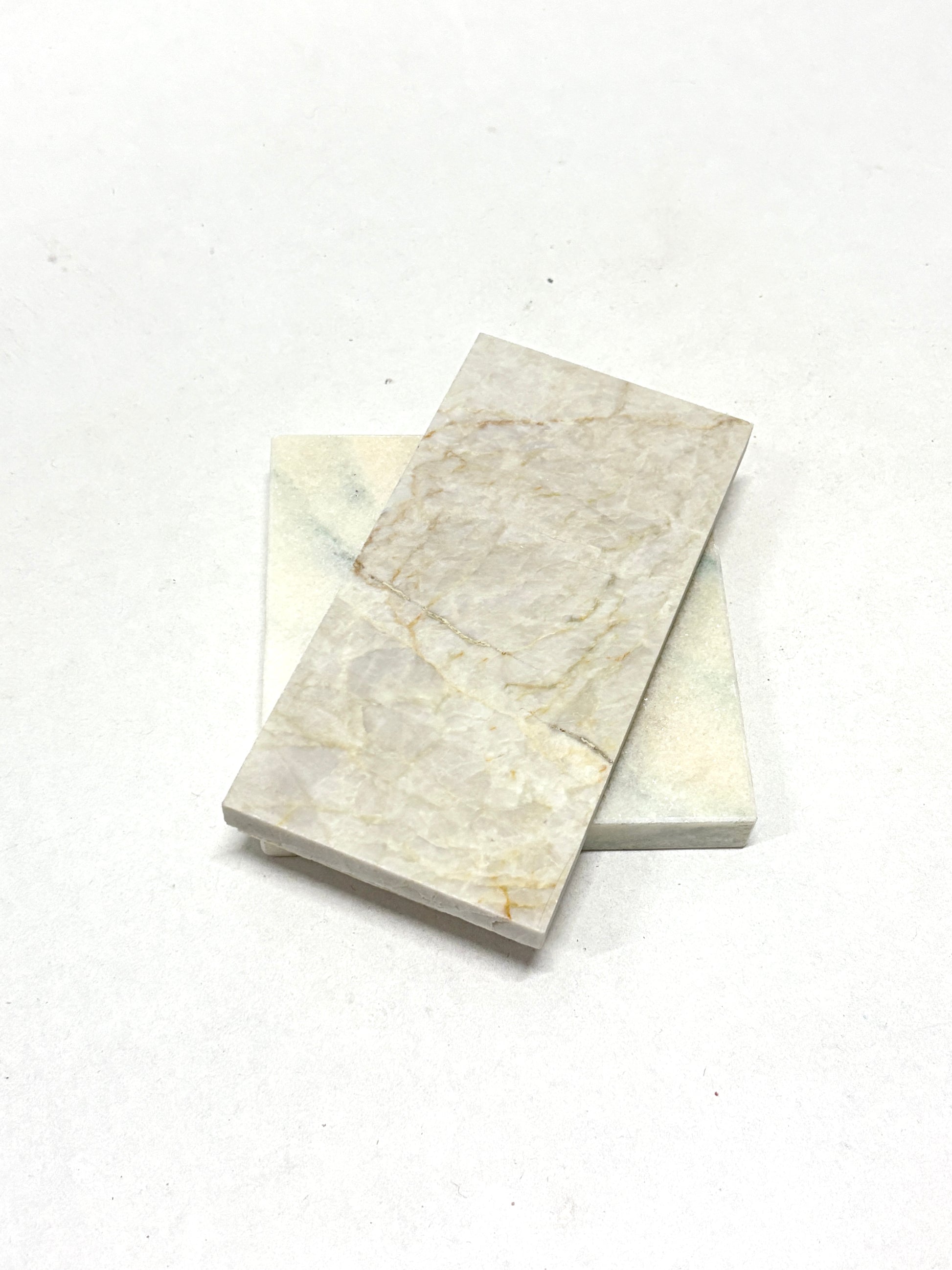 Close-up views show tile samples in different colours and veined patterns