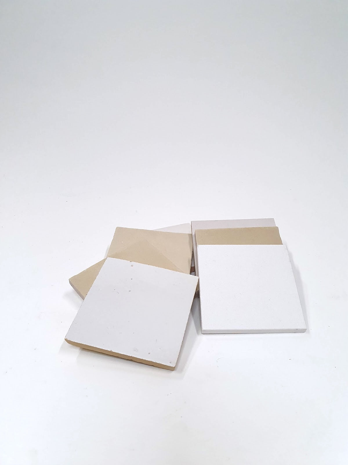 White rectangular sample tiles are arranged on a white background