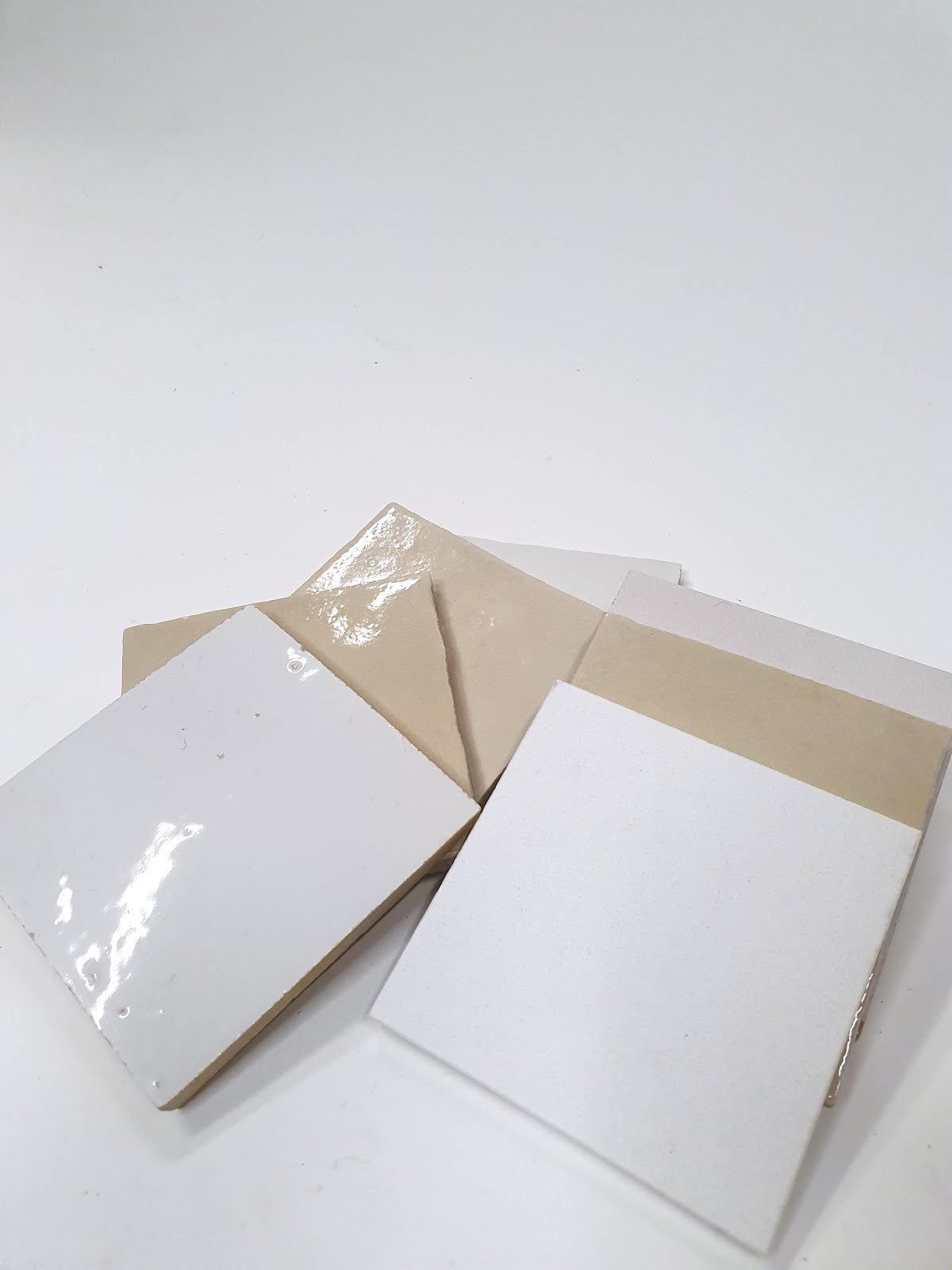 White and beige sample pieces are shown in a small grouped layout