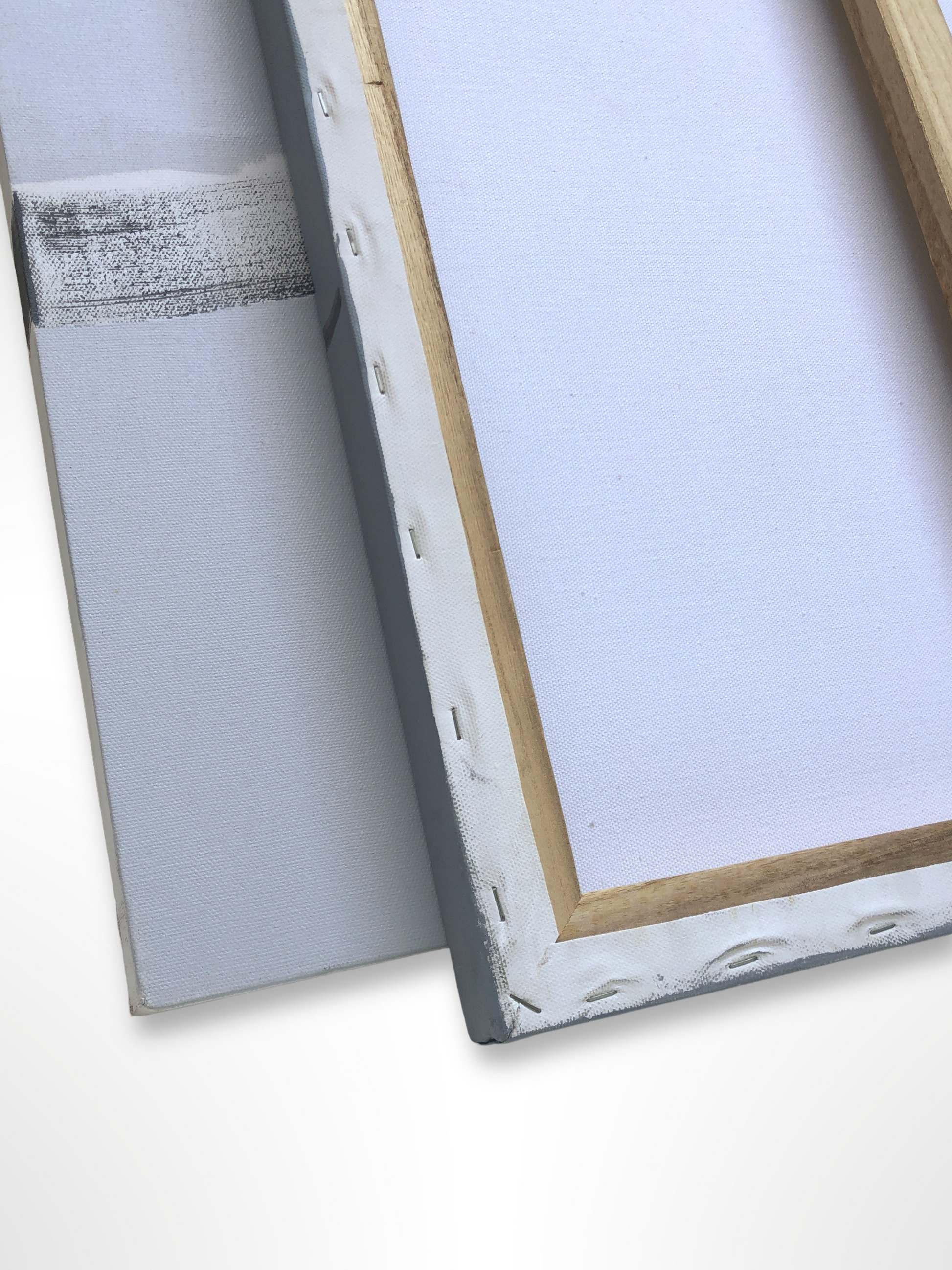 Two canvas frames and a grey panel are shown from the back