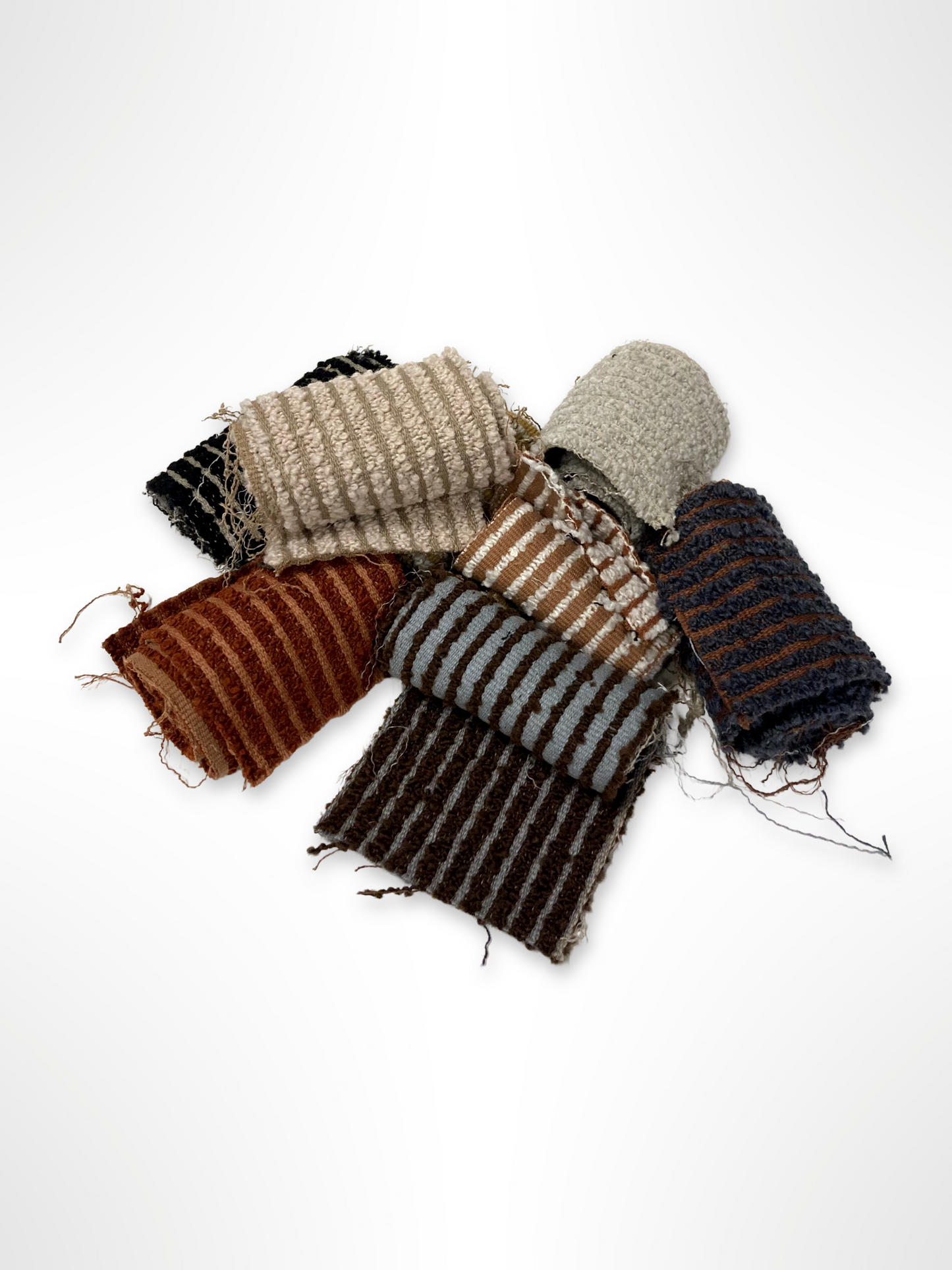 	Small textile swatches are grouped together on a white background.