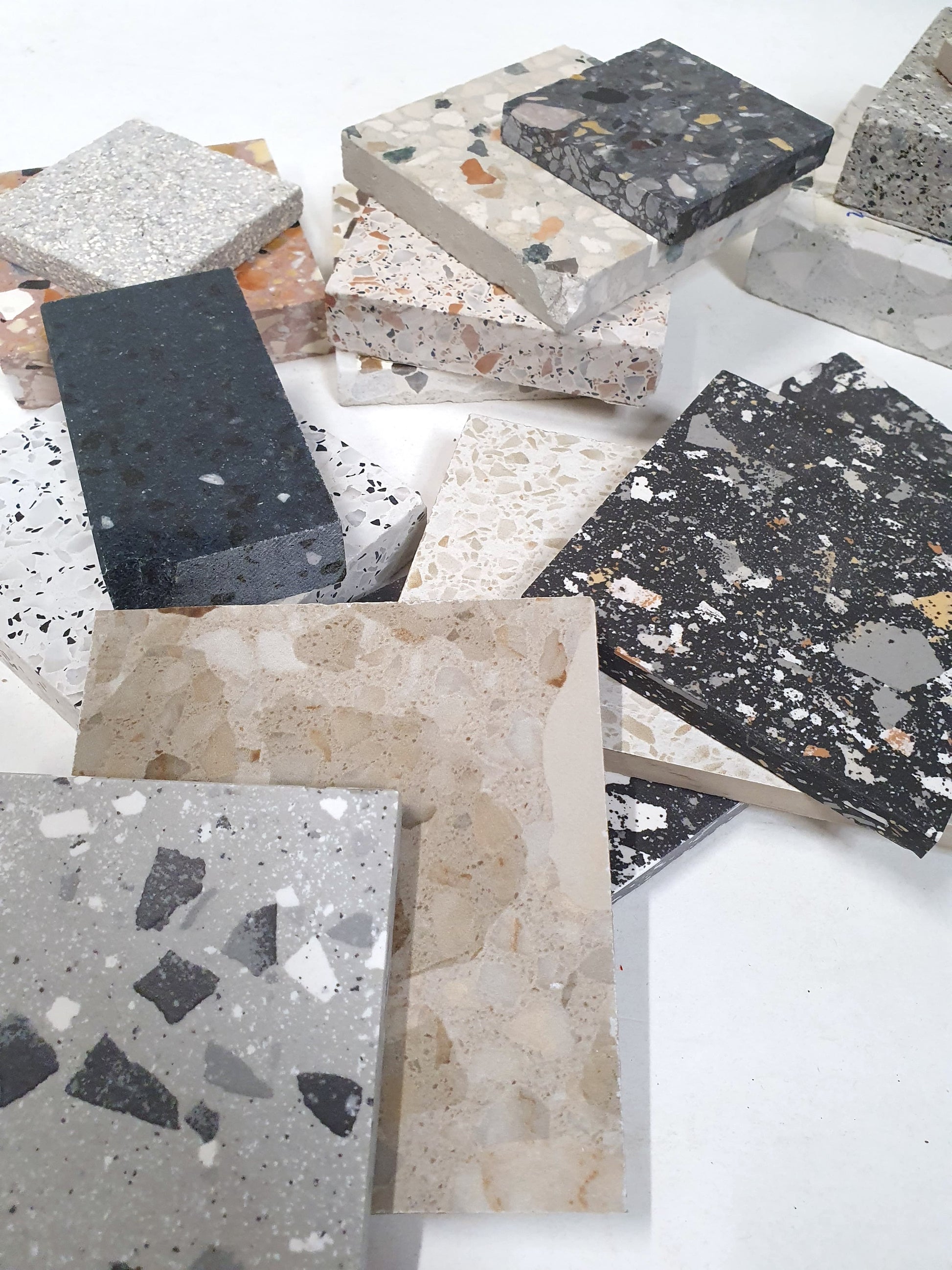 Close-up views show terrazzo tiles in different colours and chip patterns