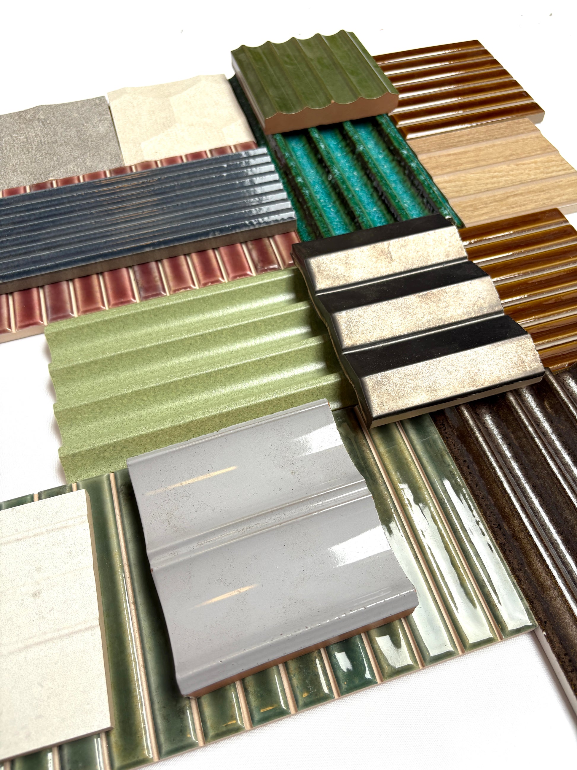 Assorted textured tiles from a mixed bundle displayed on a white background.