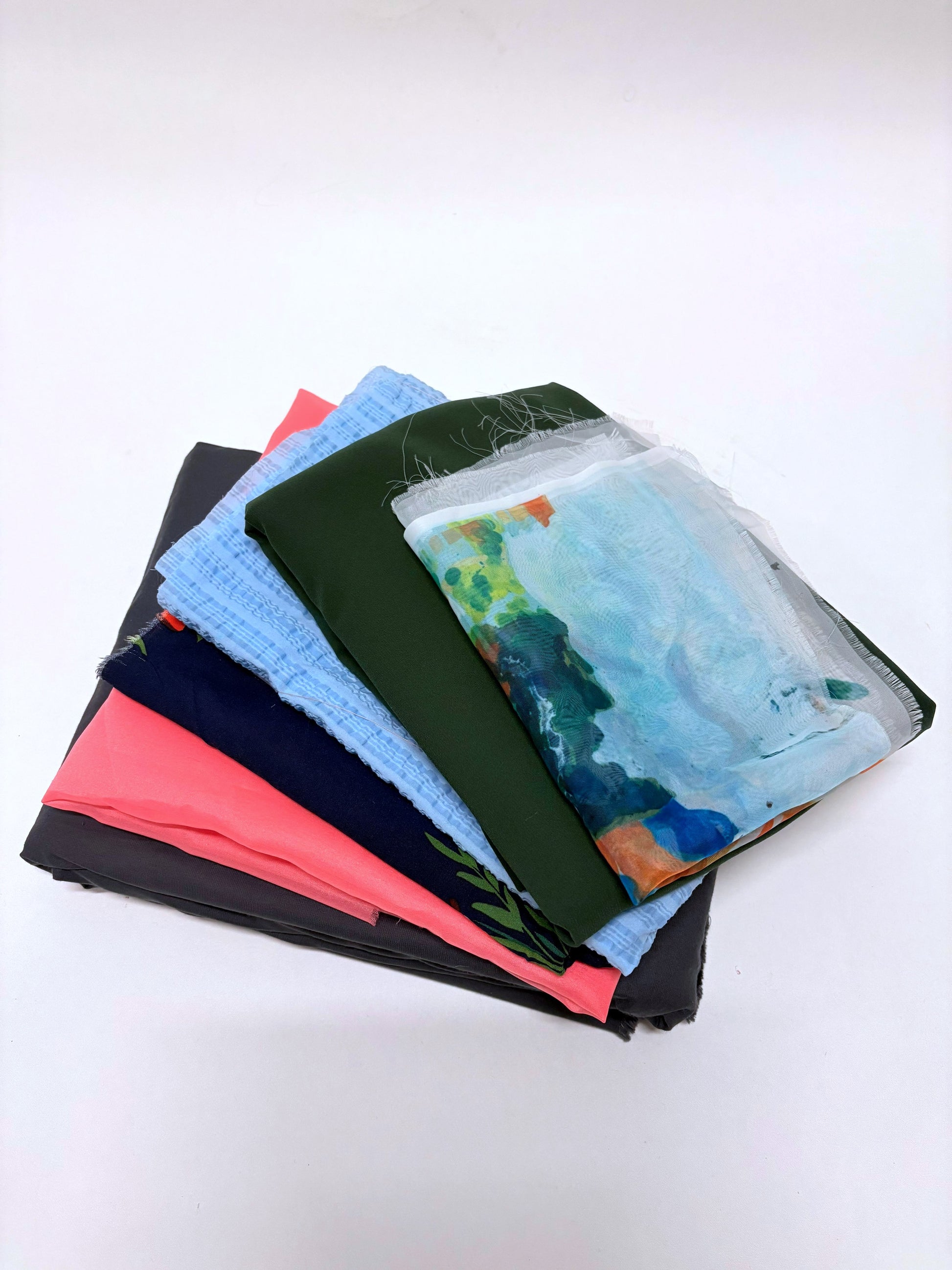 Close-up view shows fabric pieces in different colours and prints