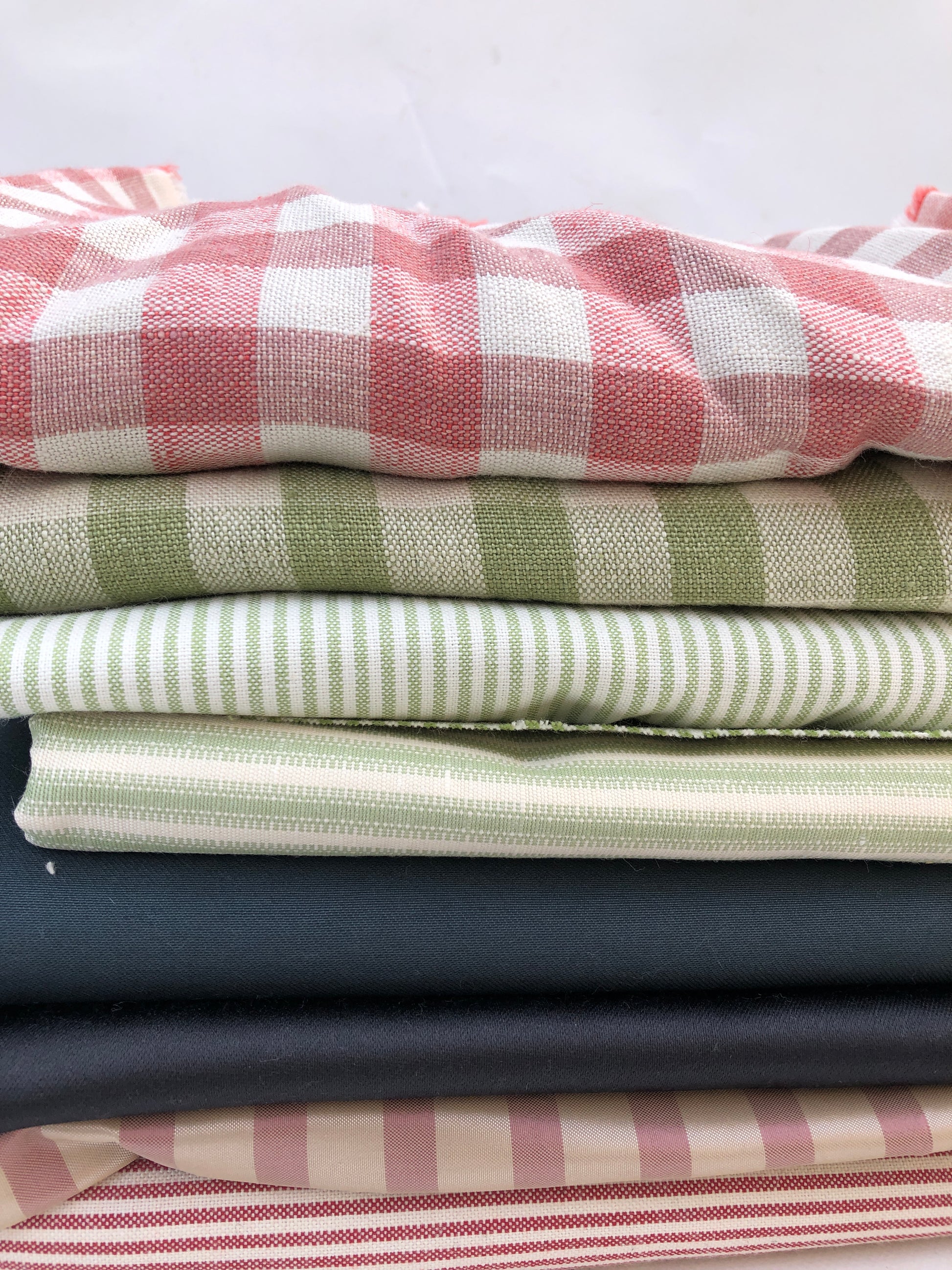 A checked fabric piece is laid flat on a white background