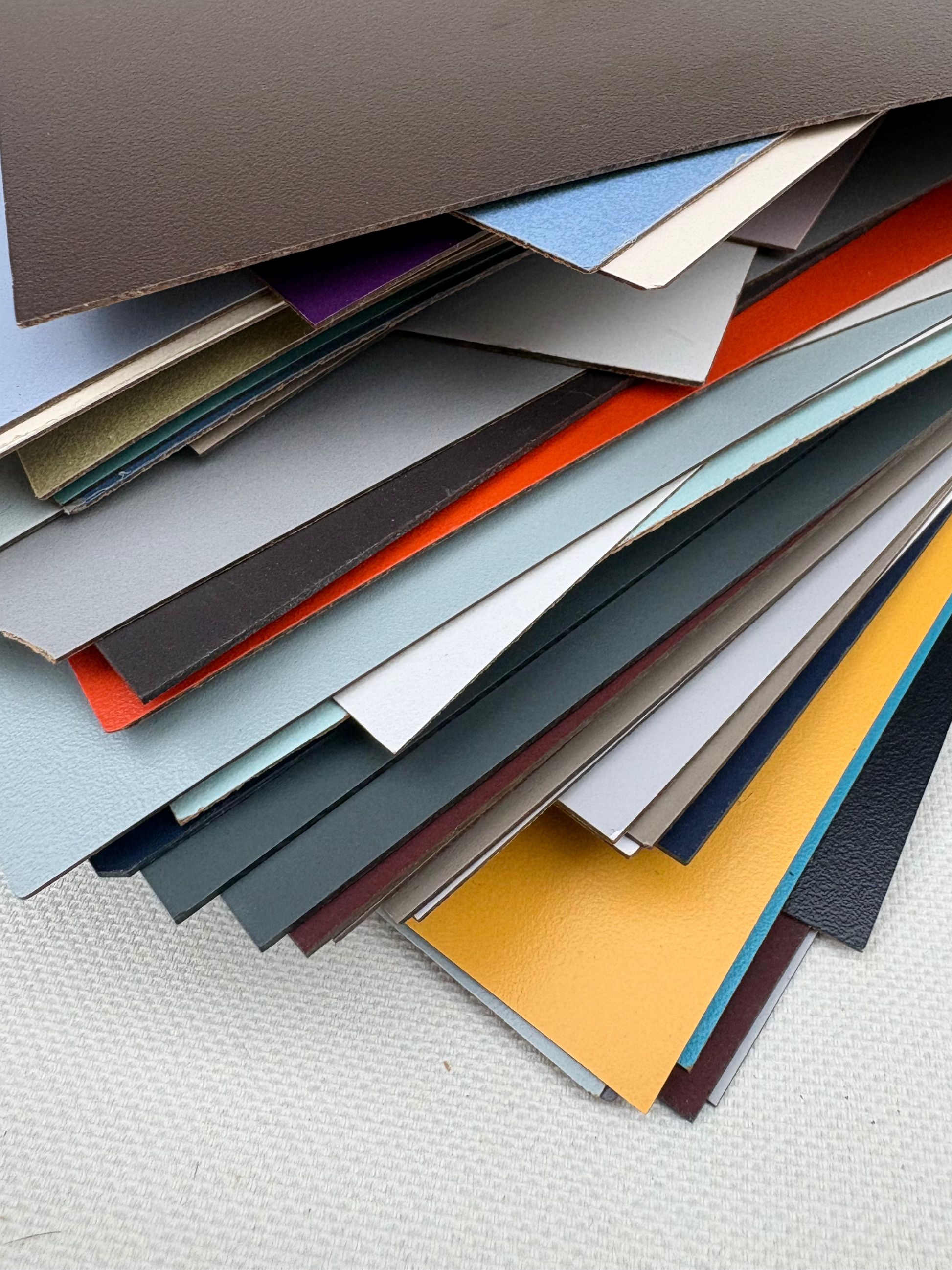 Mixed flat sample sheets are shown in different colours and finishes