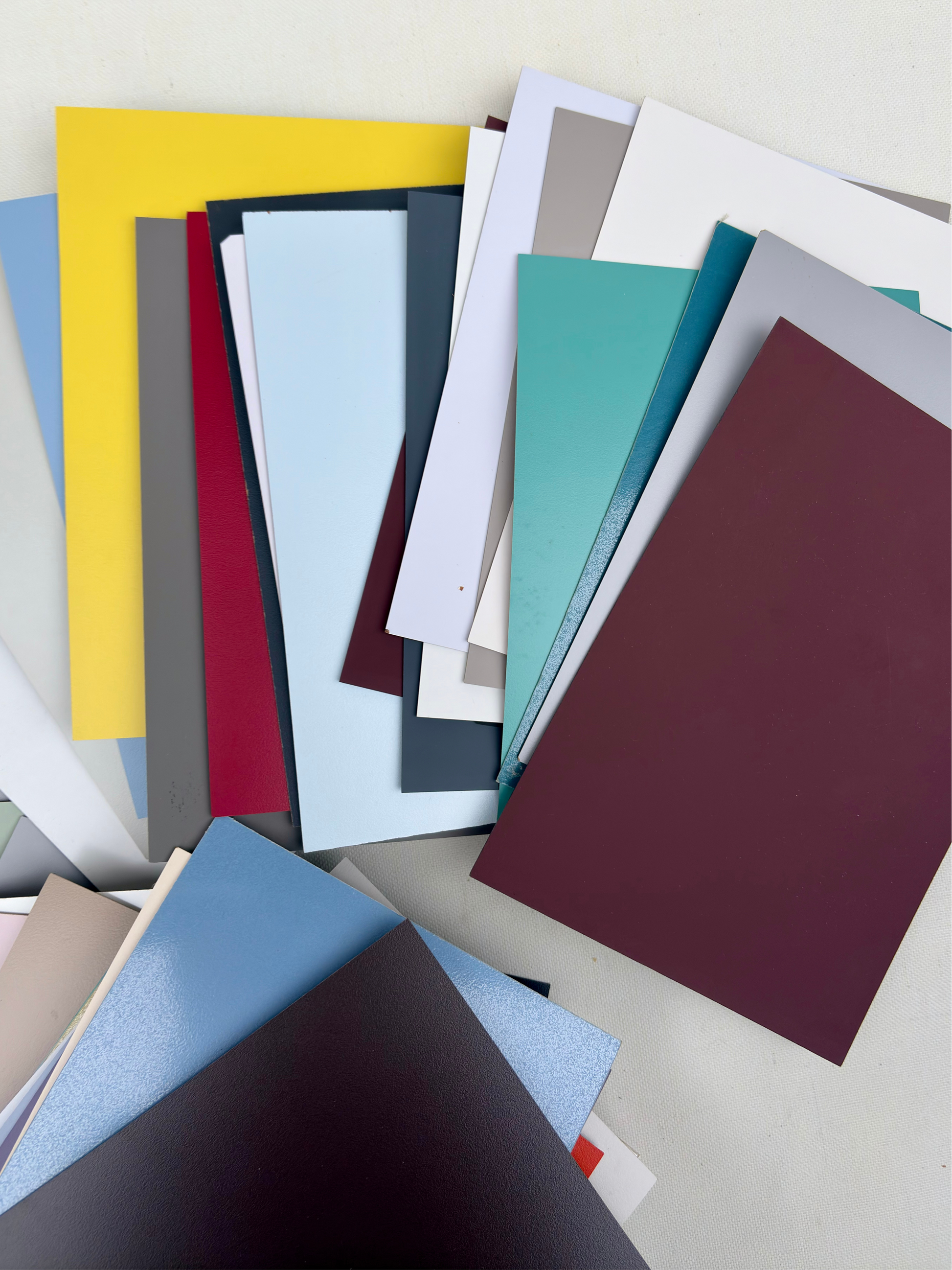Rectangular sample pieces are arranged in a stacked bundle on white