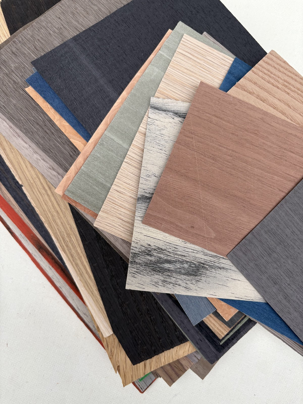 Close-up views show woodgrain and coloured surfaces in different finishe