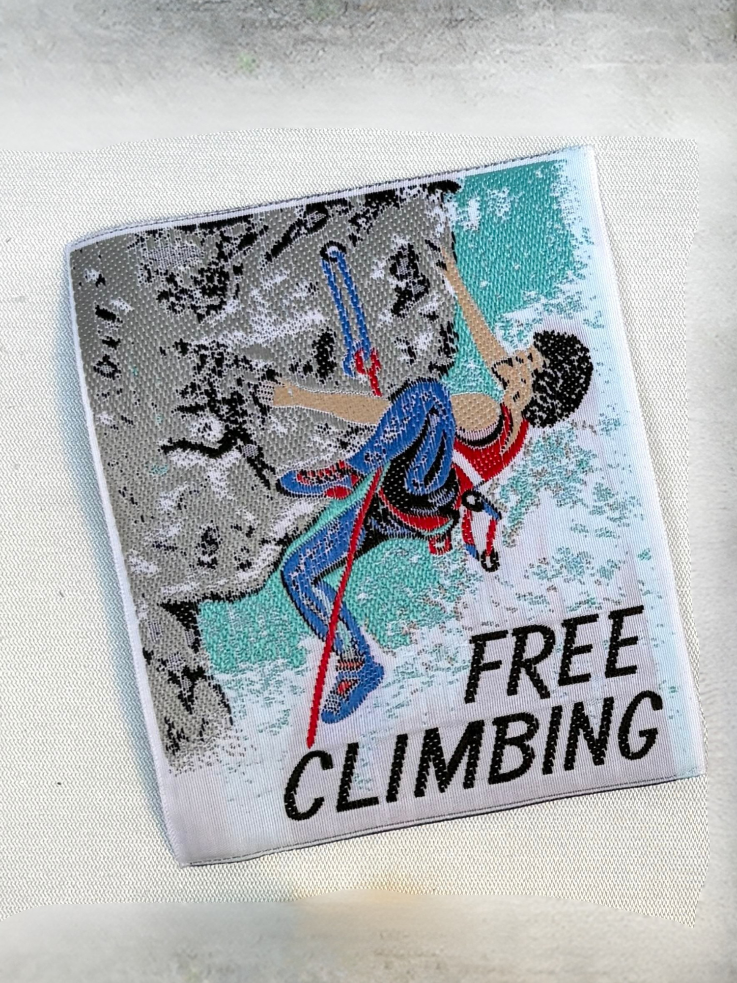 Vintage embellished badge with a retro free climbing illustration and “FREE CLIMBING” lettering.