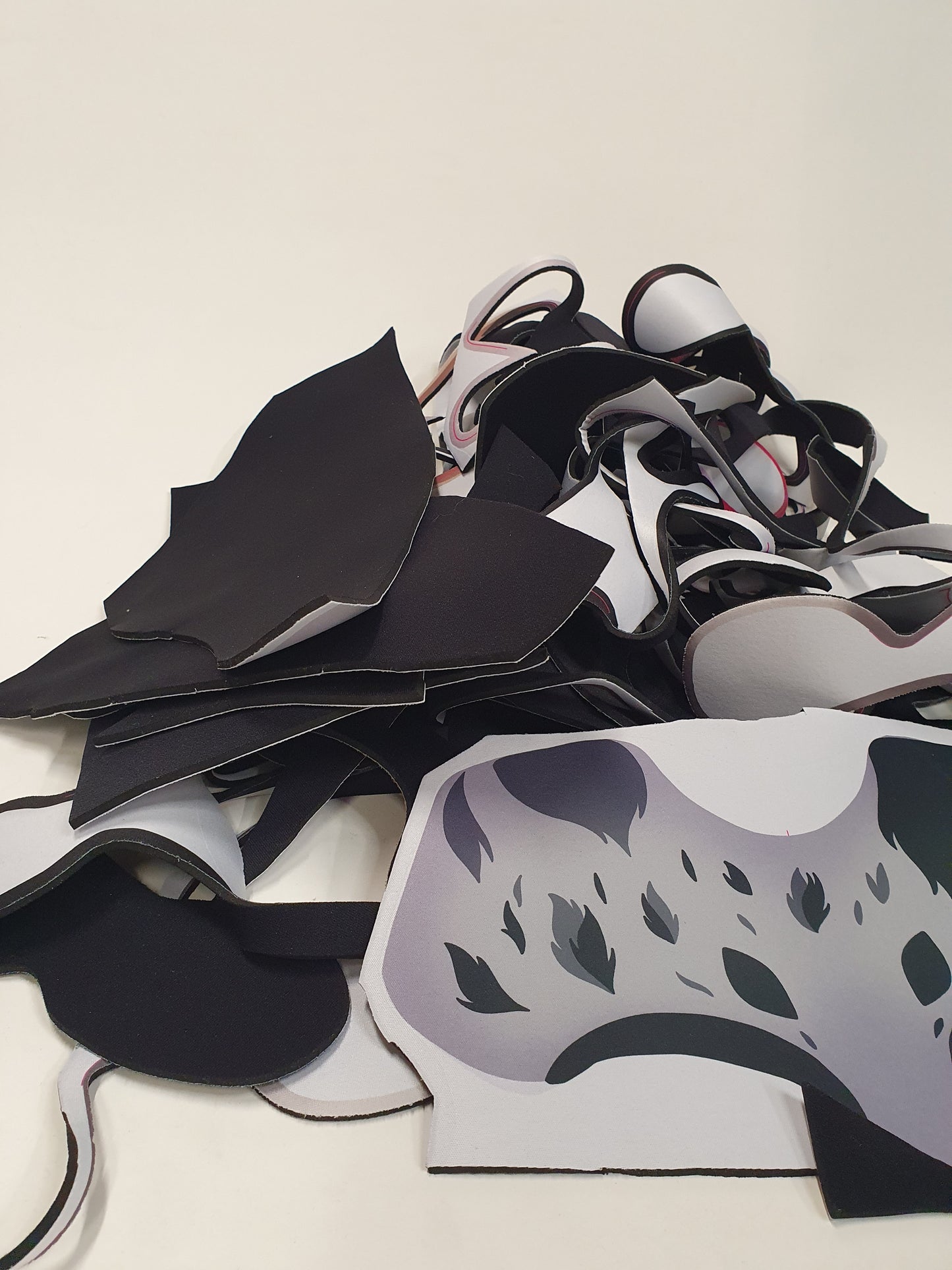 Mixed cut material pieces are shown in a loose layered bundle