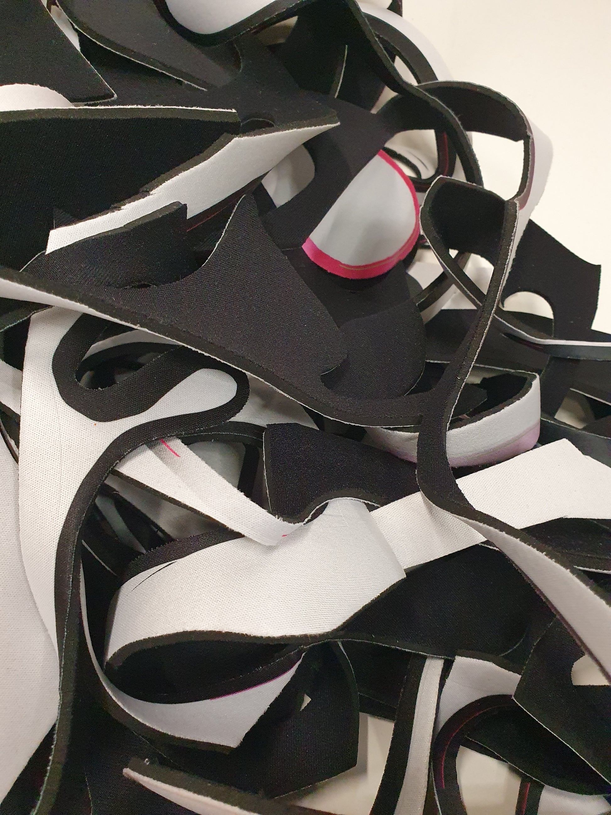 Close-up views show black, white, and edged offcuts in detail
