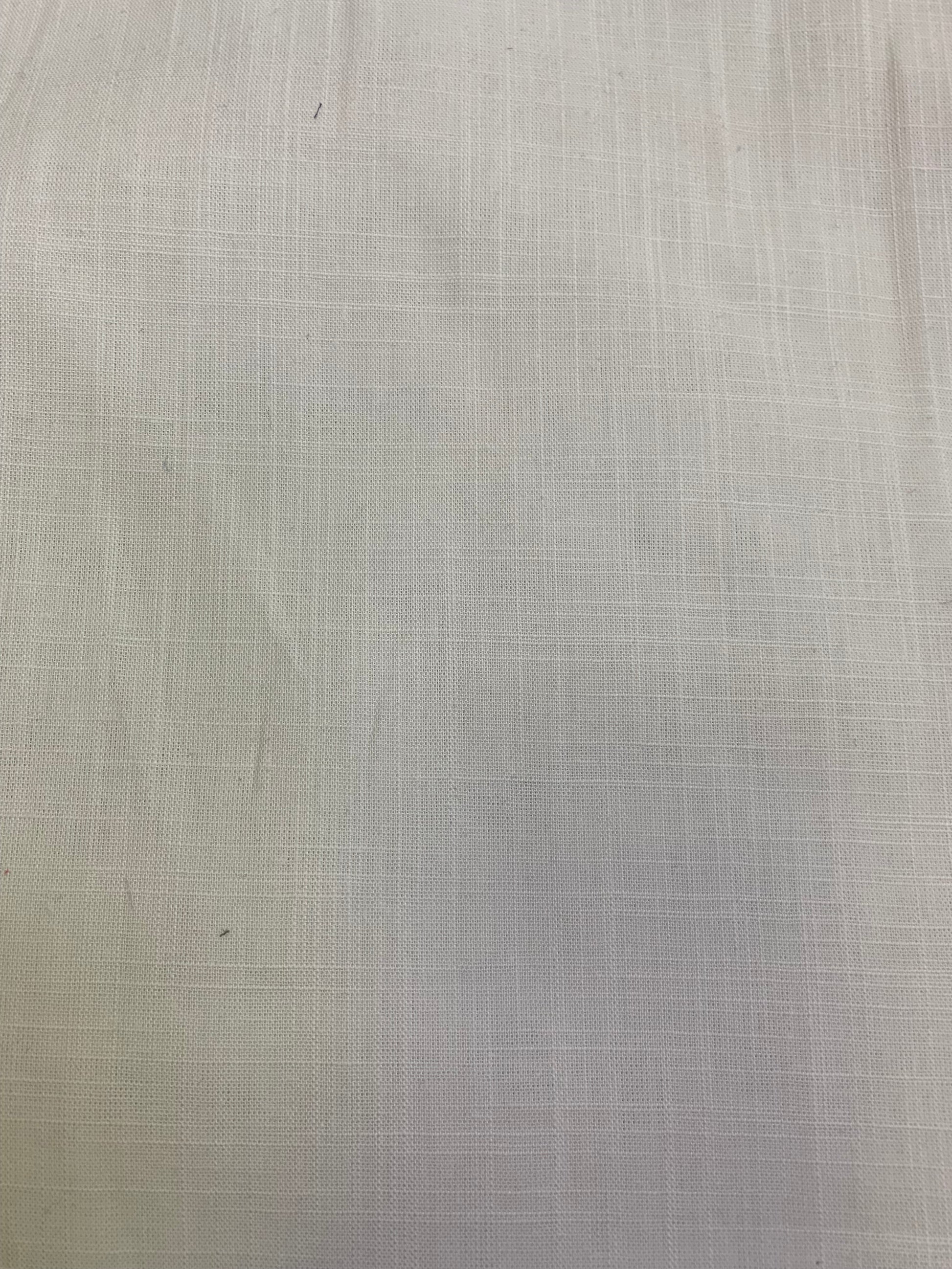 A detailed view of white viscose linen deadstock fabric with subtle woven texture.