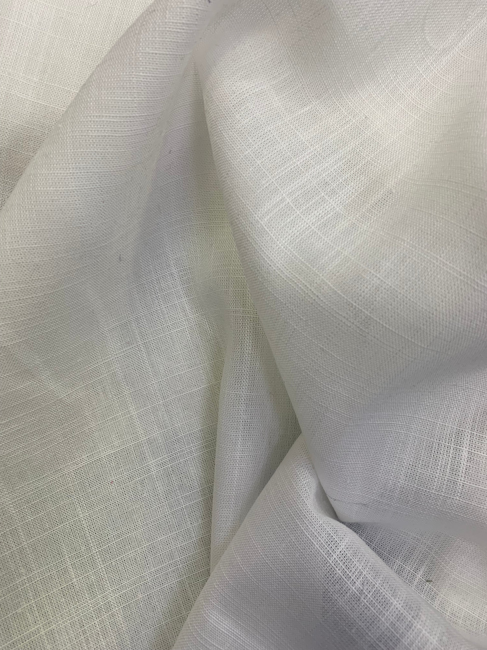 White viscose linen deadstock fabric shown in a softly folded close-up.
