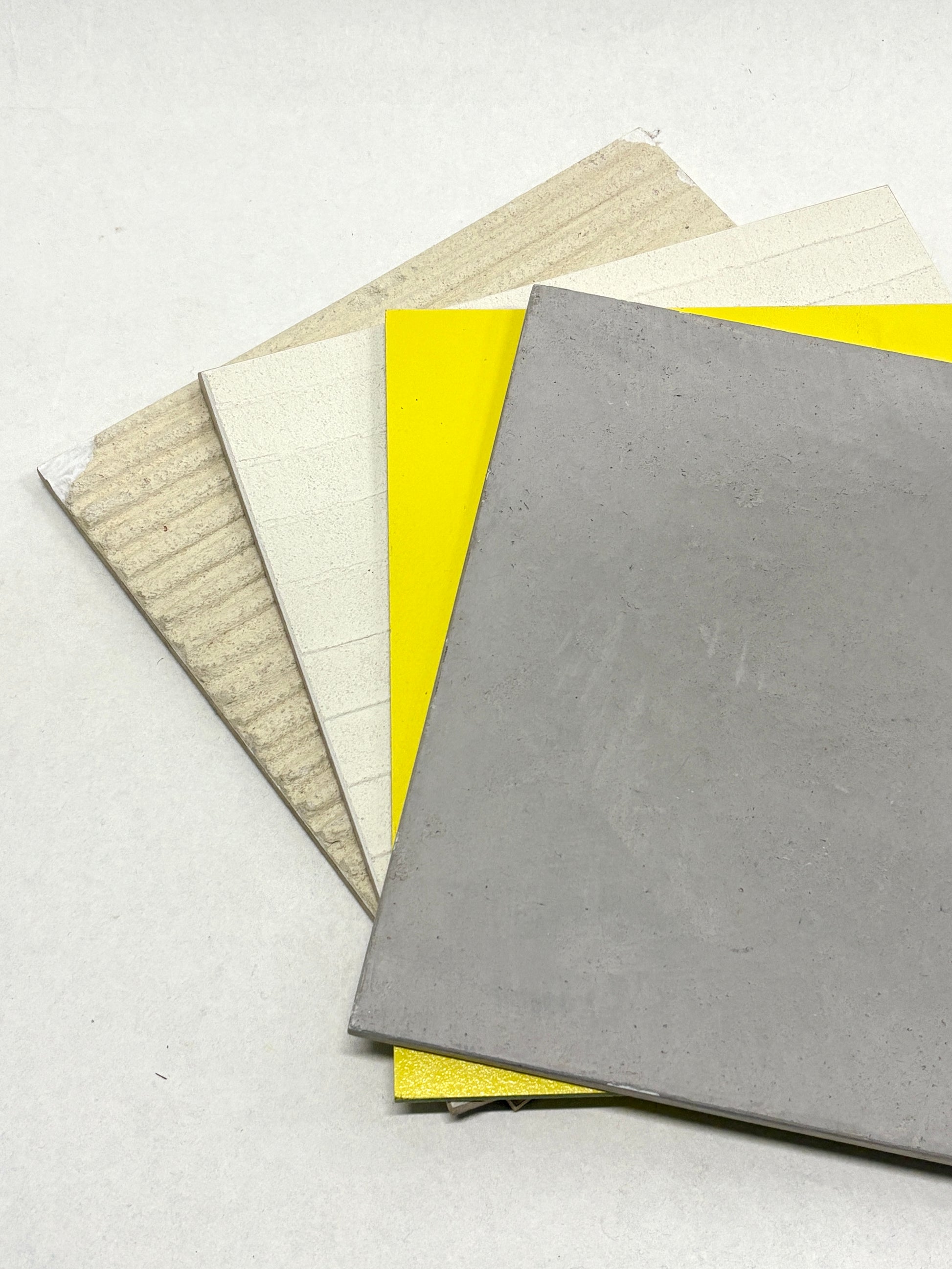 Close-up views show stacked boards with smooth and textured surfaces