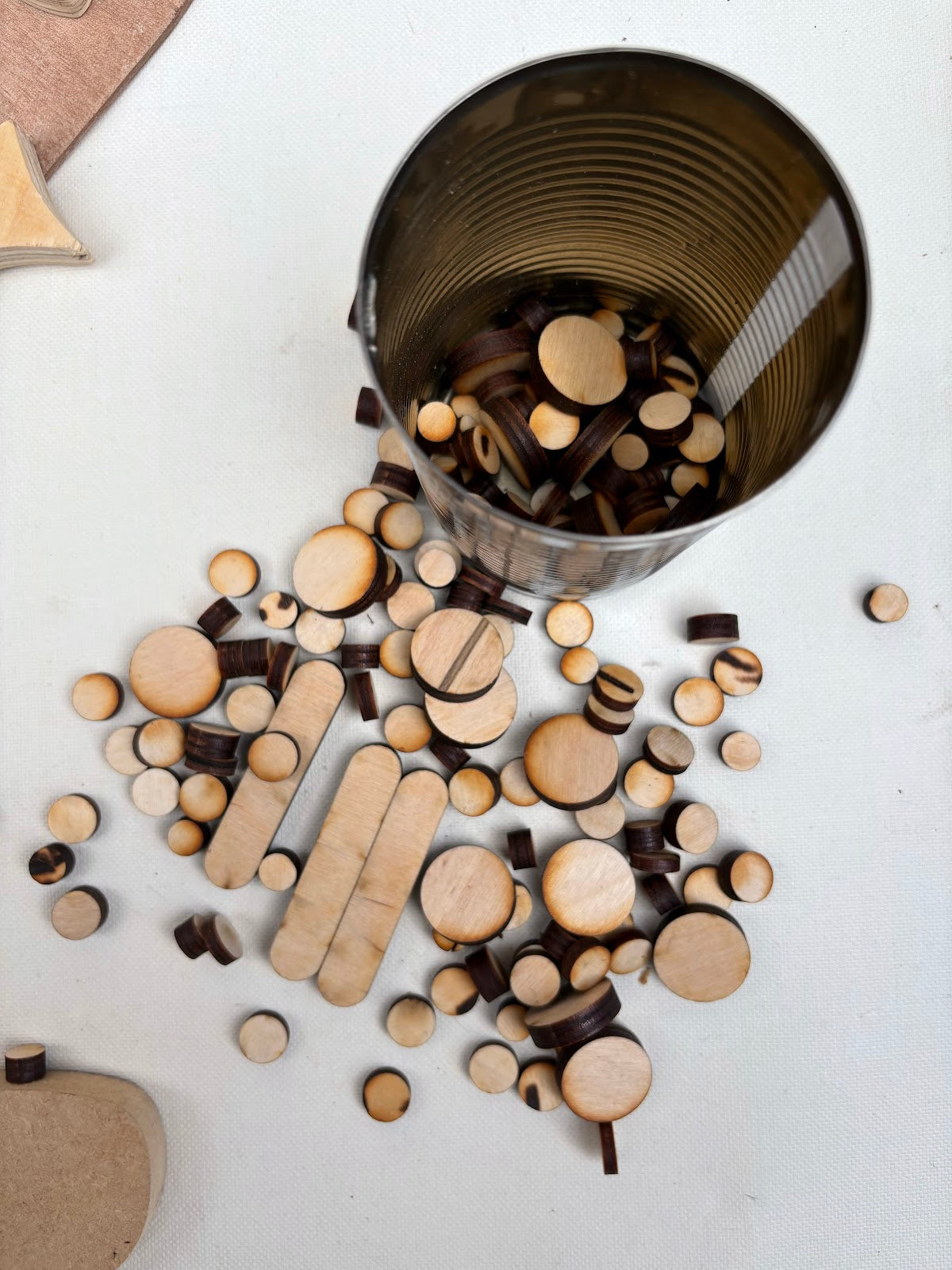 Wood craft pieces are displayed in stacked and detailed close-up views