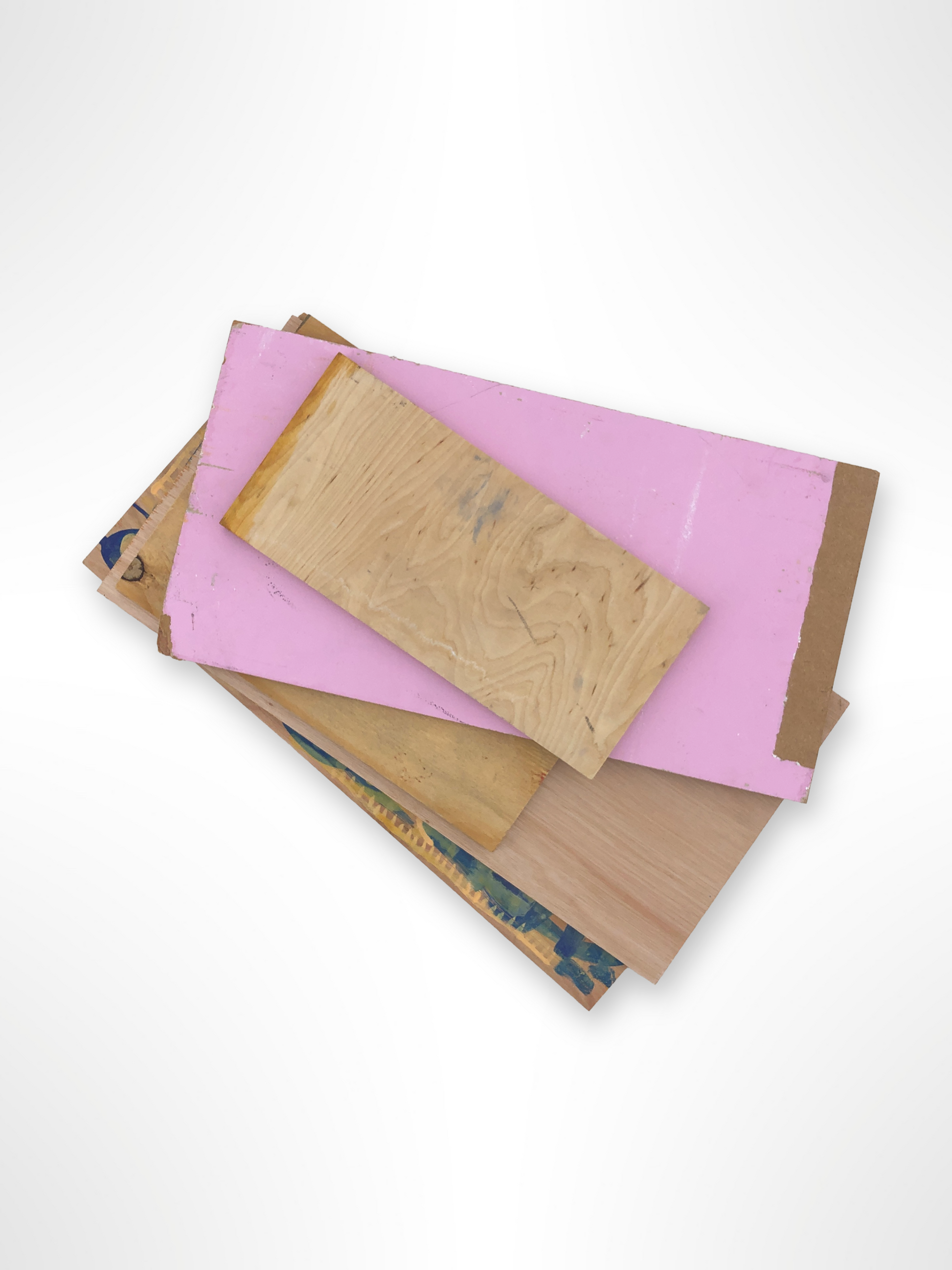 Mixed wooden panels in different colours are layered together