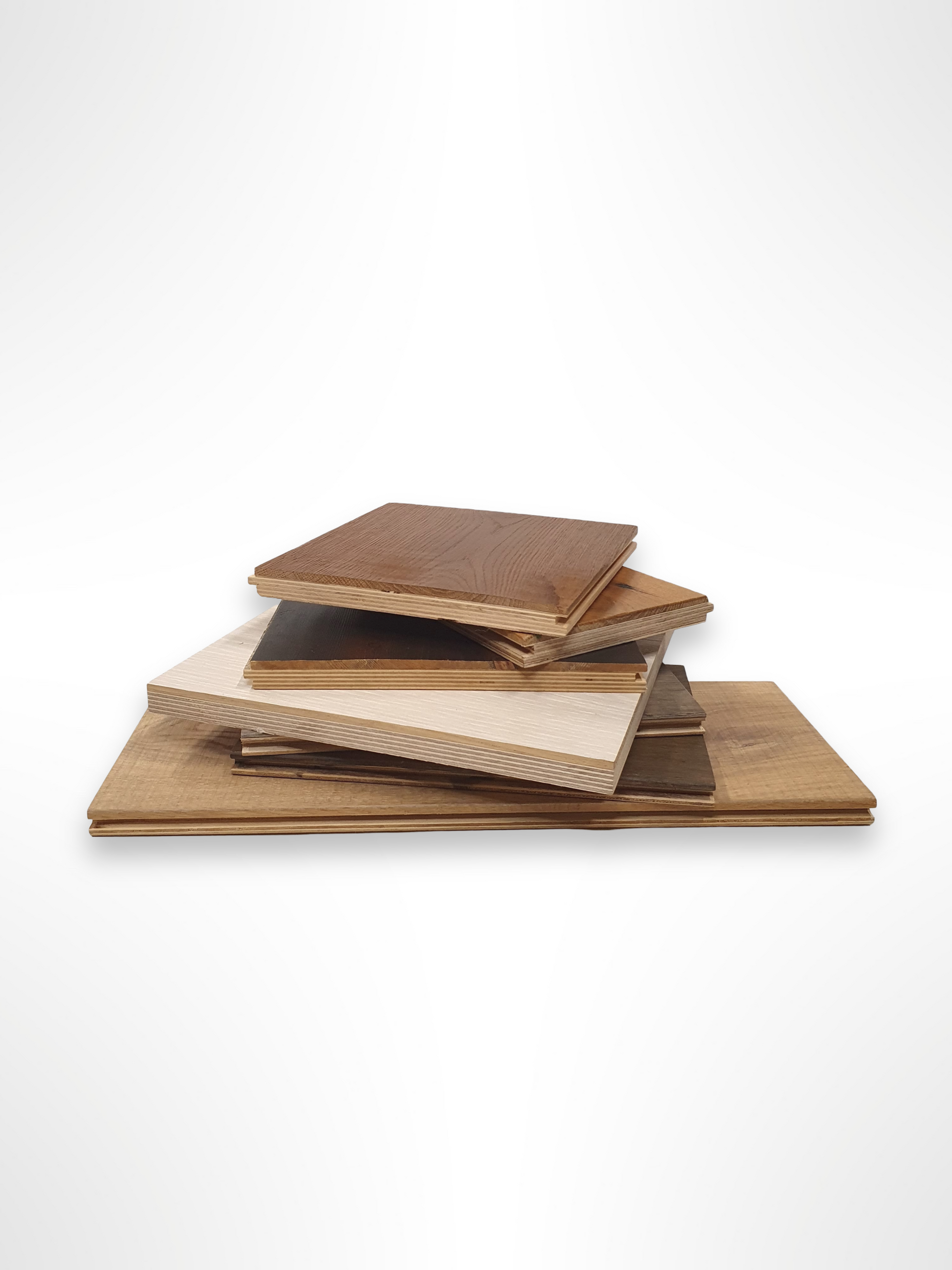     Small wood boards are stacked in a neat pile on a white background