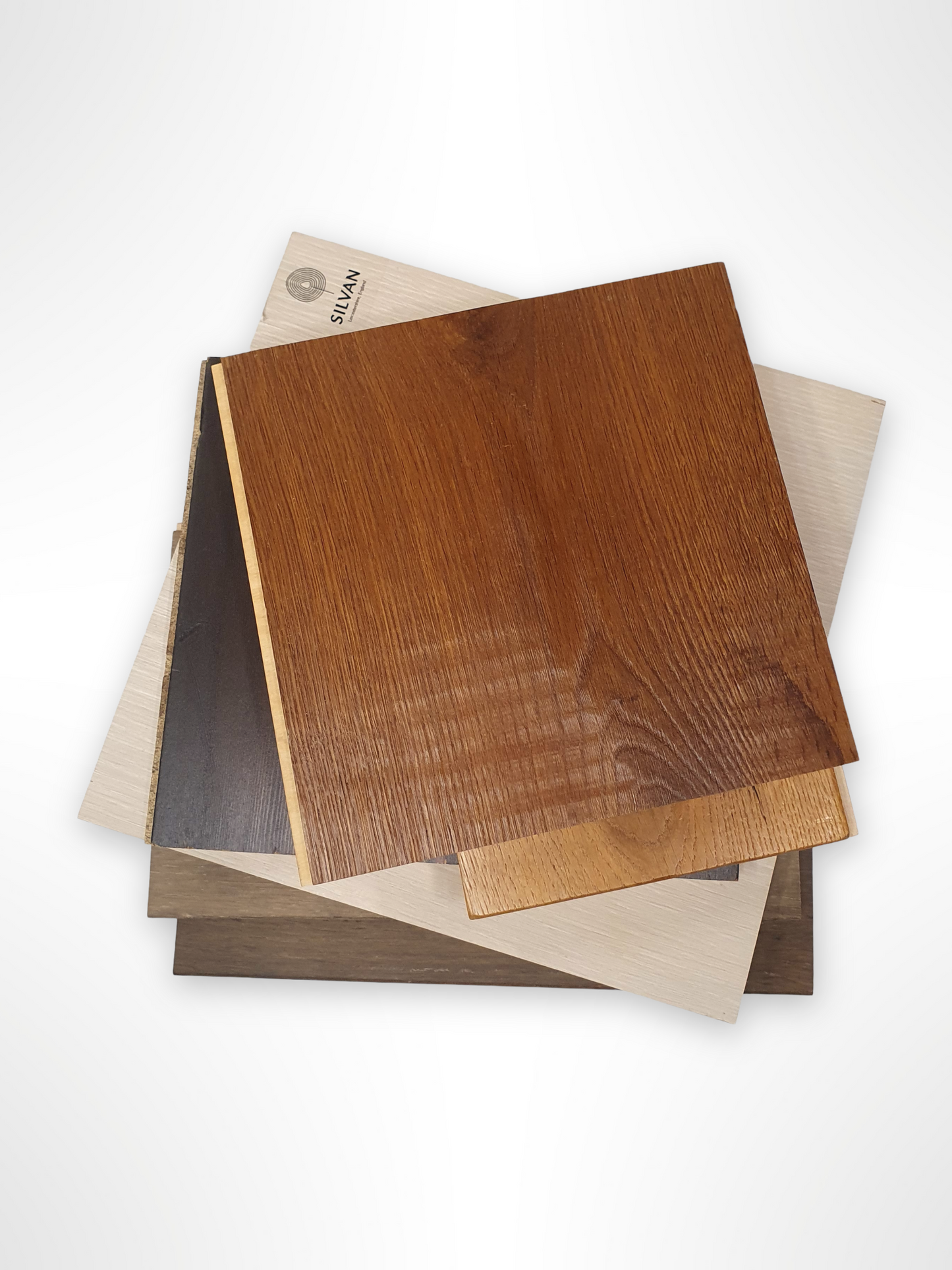     Mixed wood sample boards are layered in a close stacked view