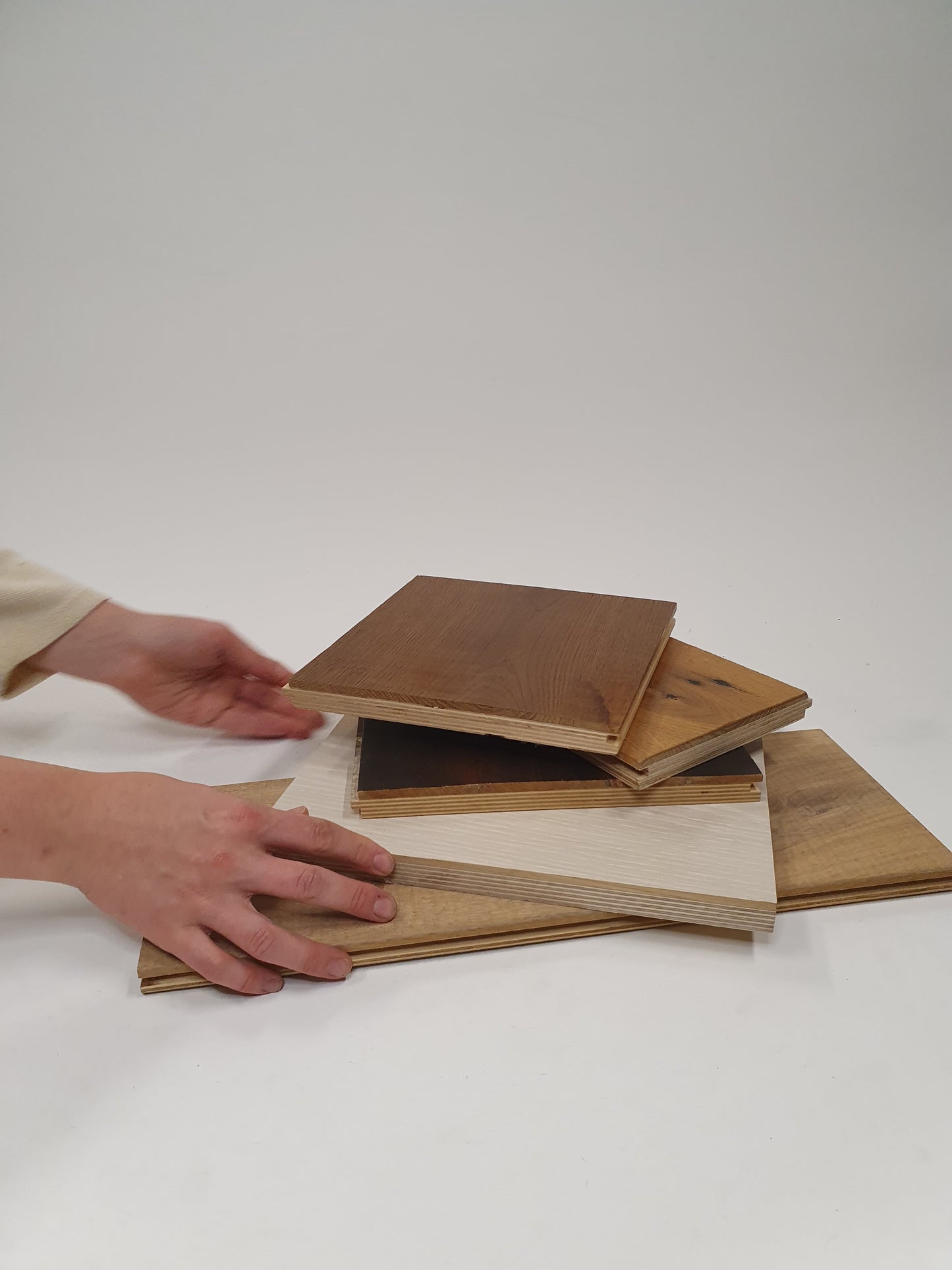     Close-up view shows layered boards in different wood tones and finishes
