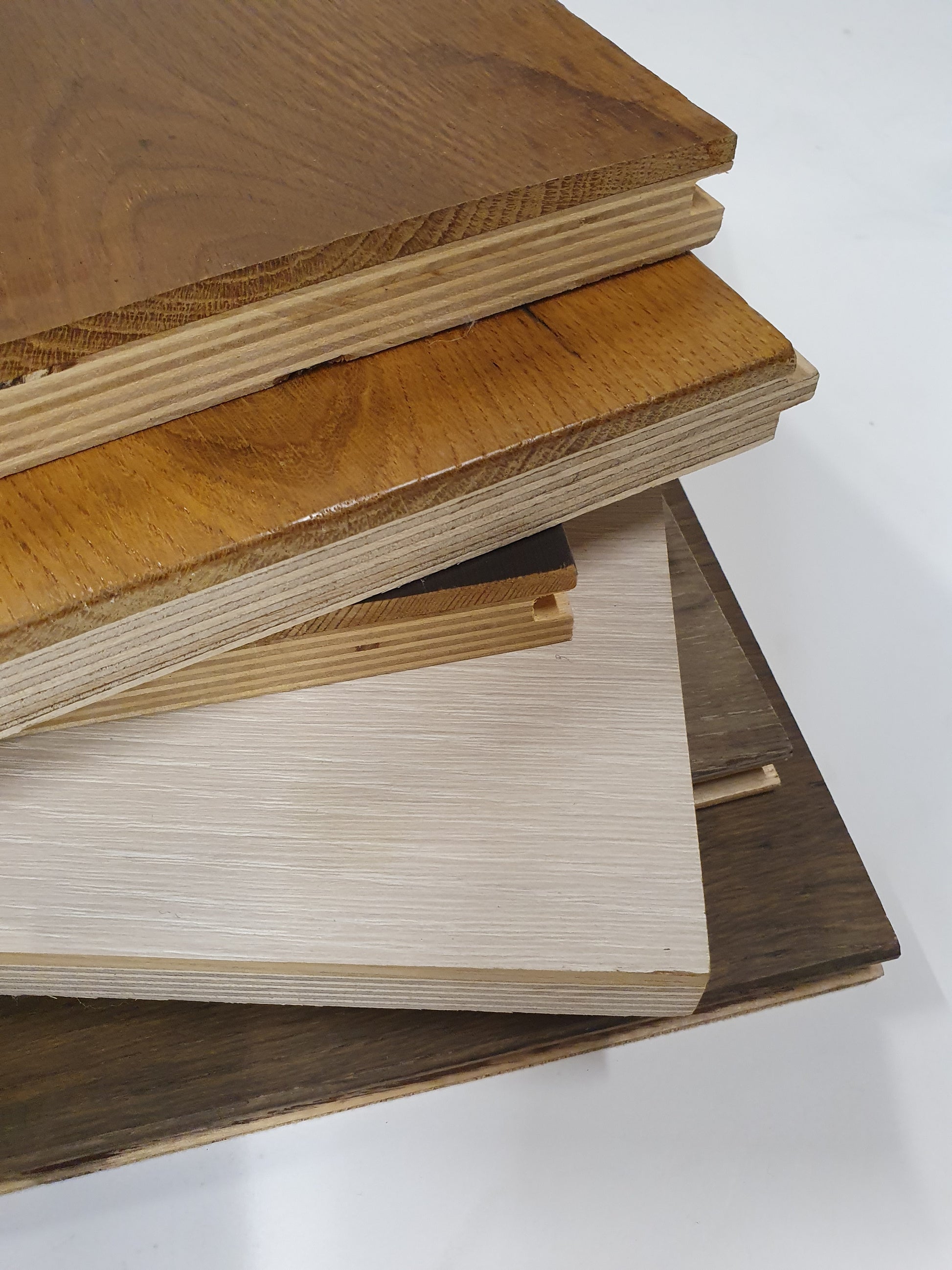     Wood sample boards are stacked upright in a close detailed view