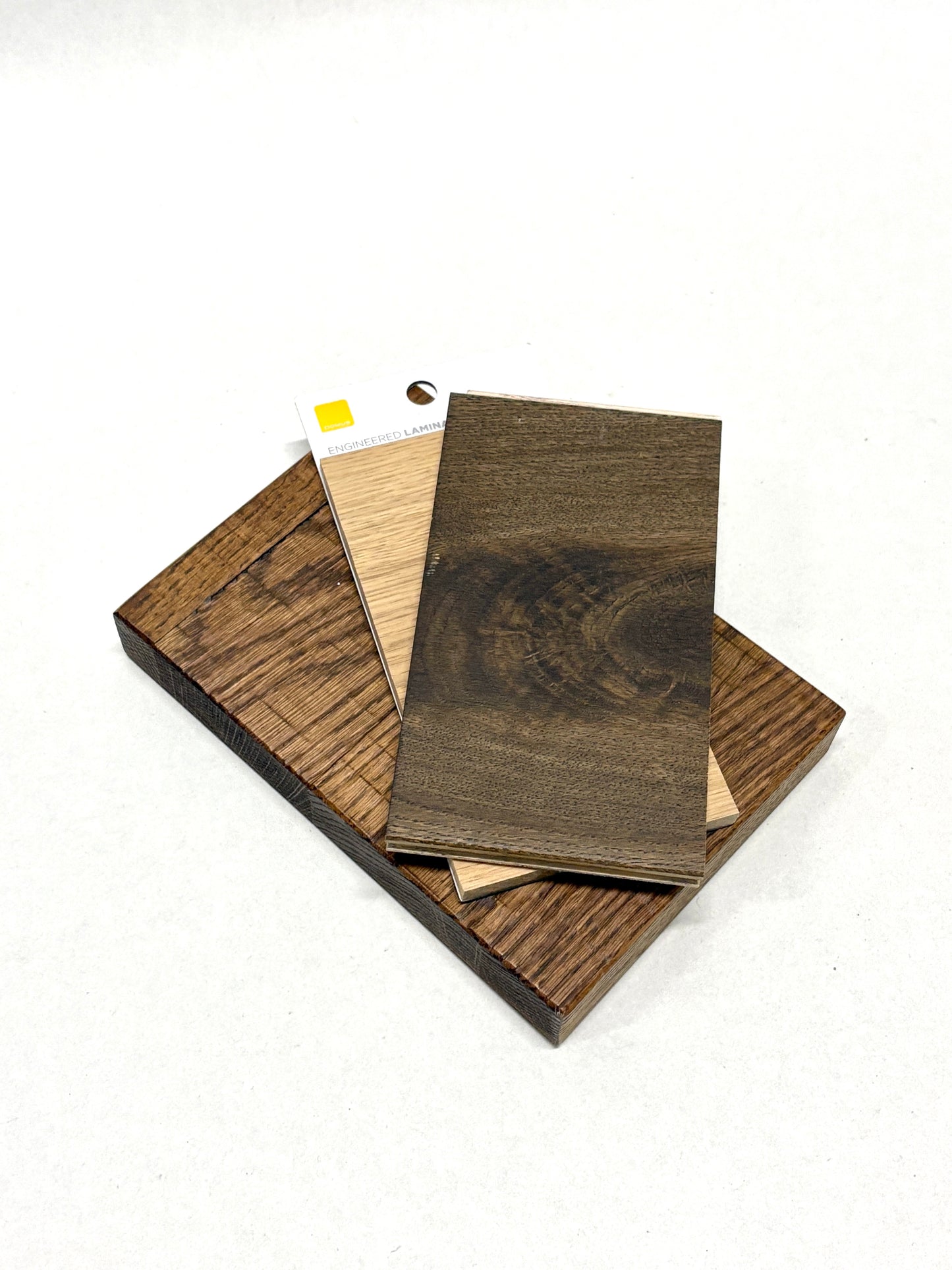 Assorted sample panels show different wood tones and finishes