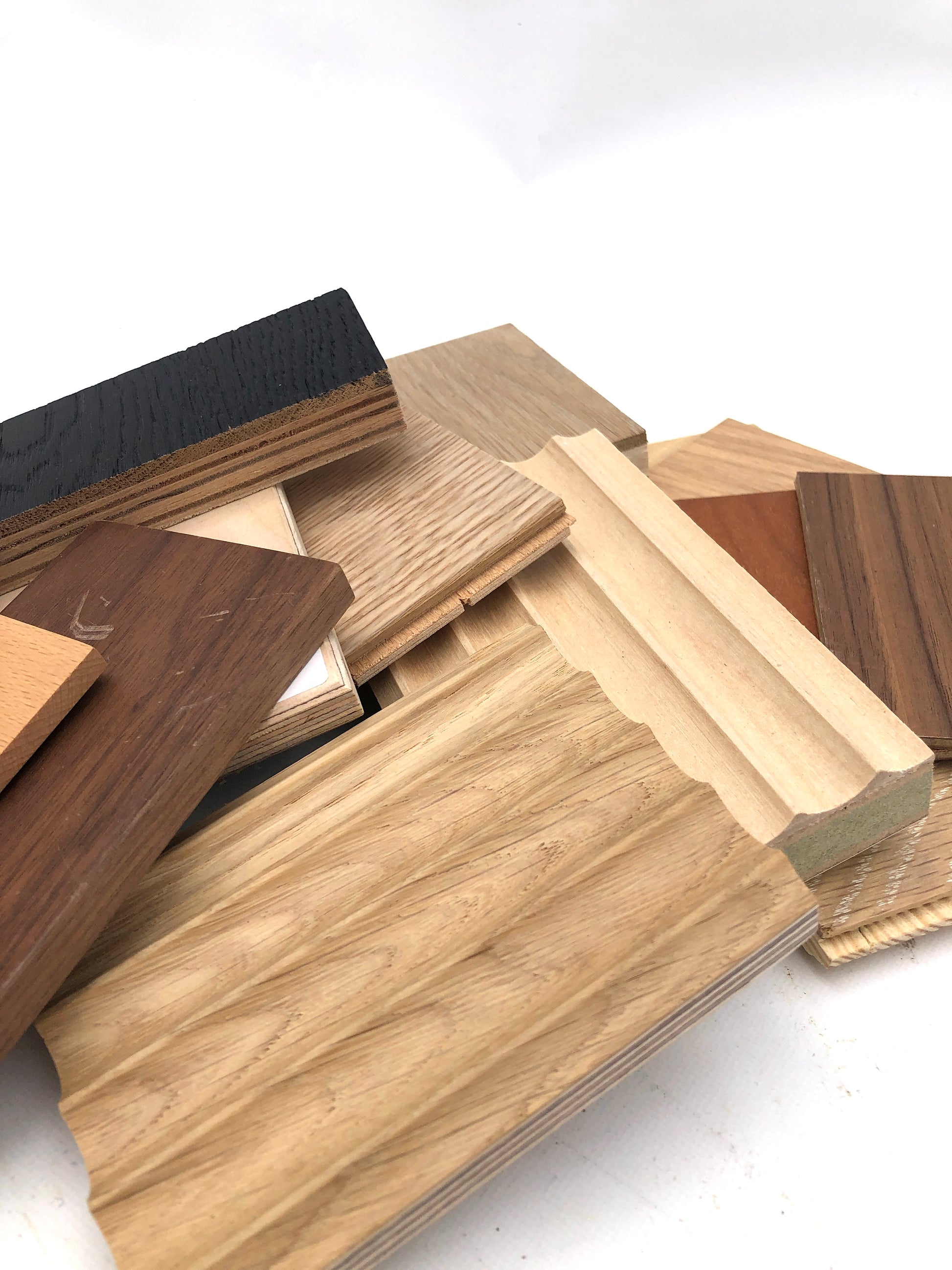 Close-up views show stacked wood samples in varied shapes