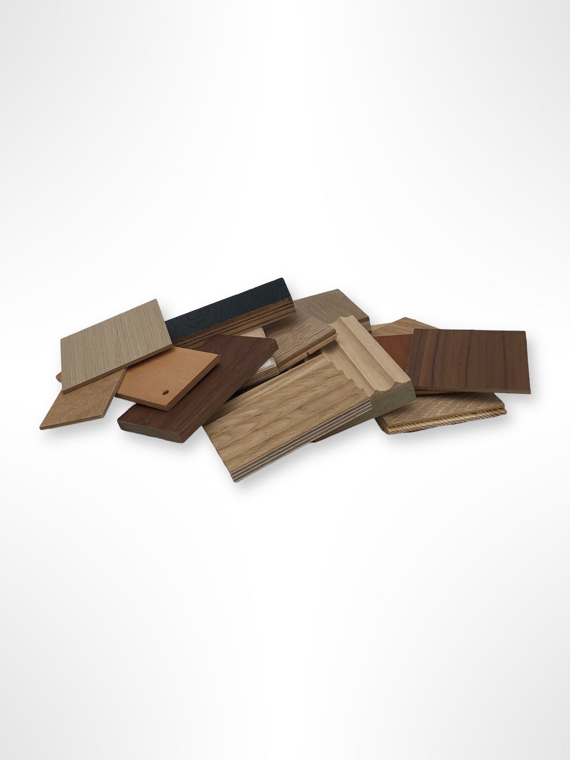Mixed wood sample pieces are arranged on a white background