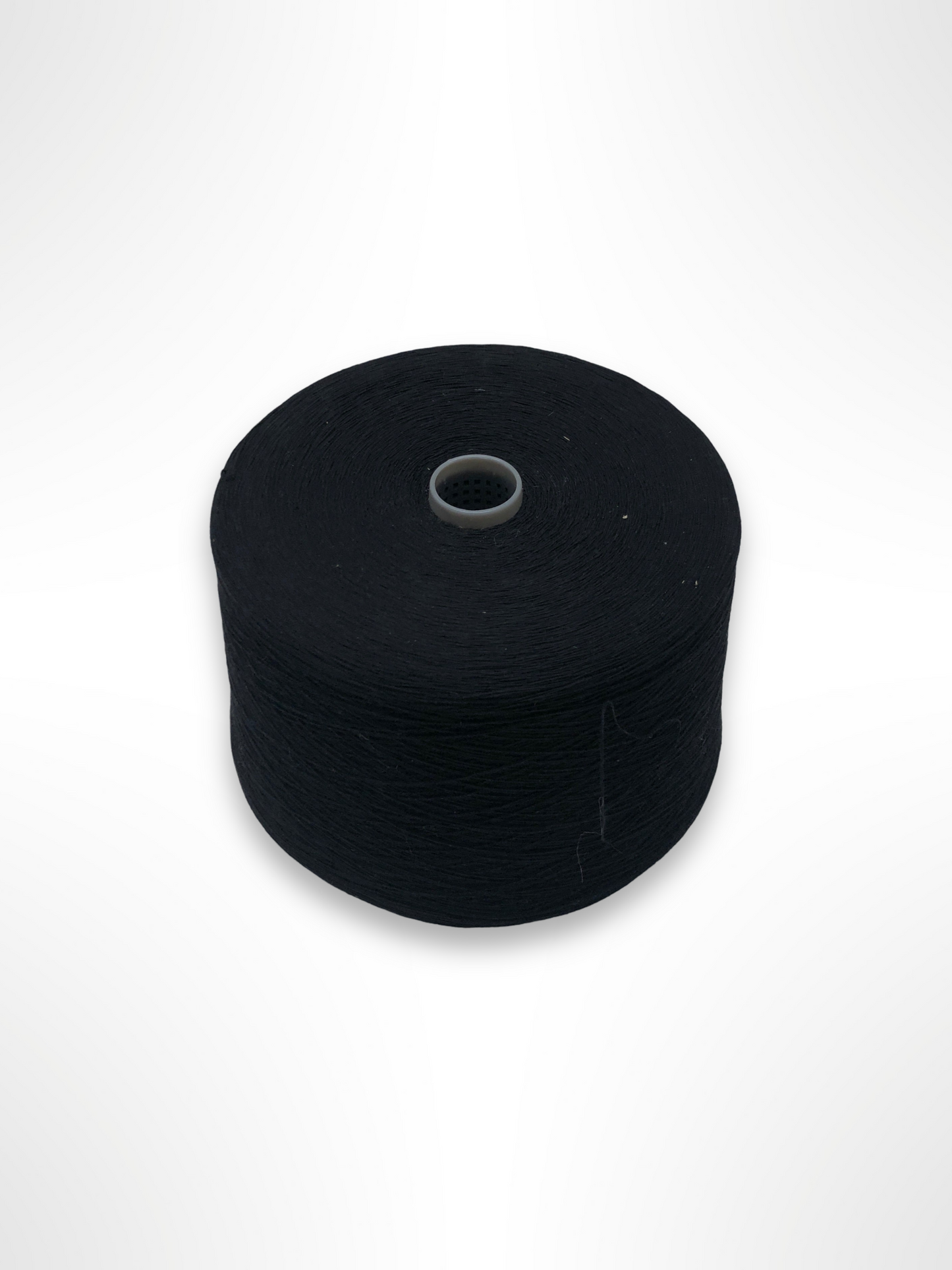 A black thread spool is shown in detail 