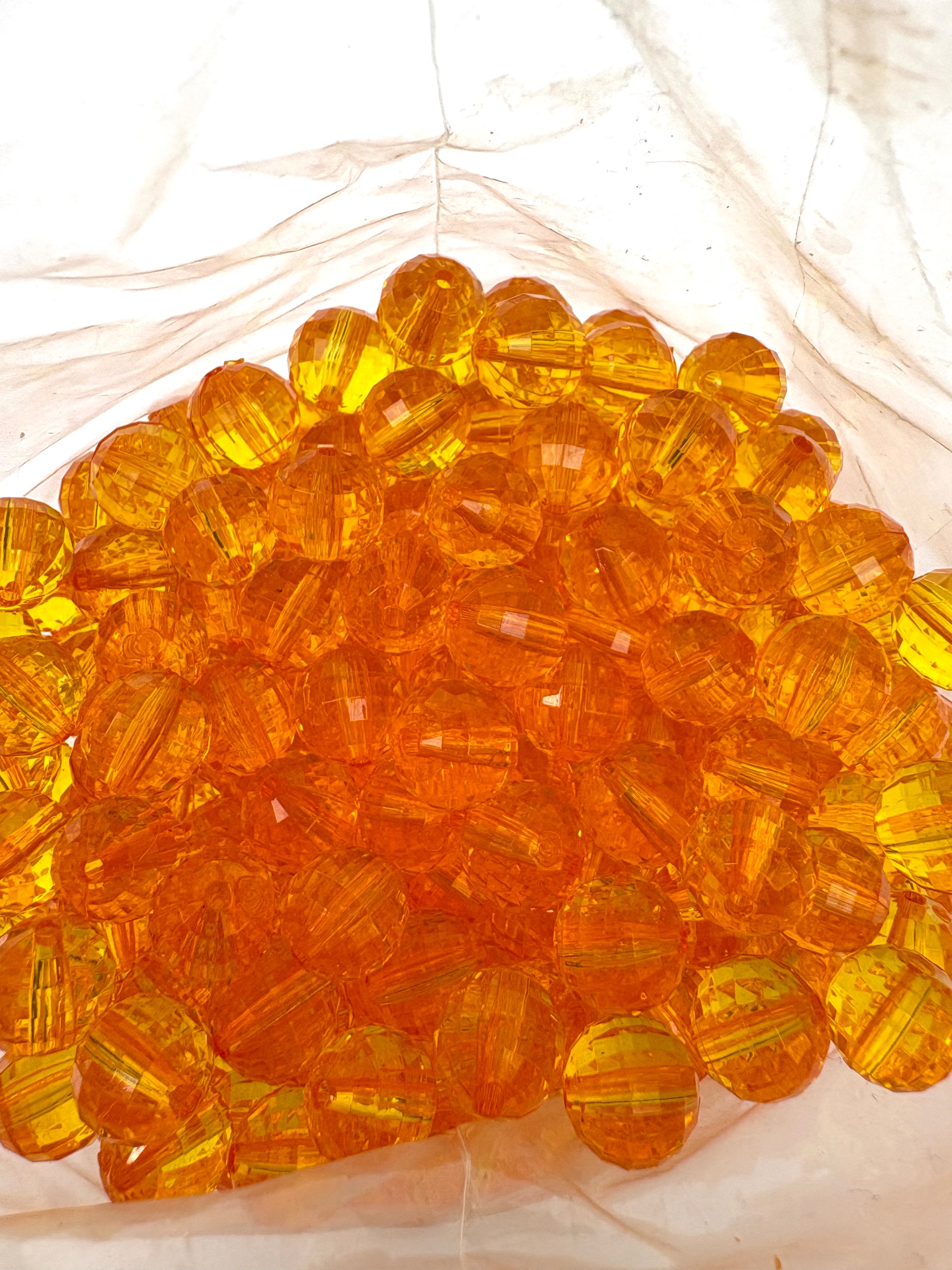 Close-up of amber-coloured acrylic beads 