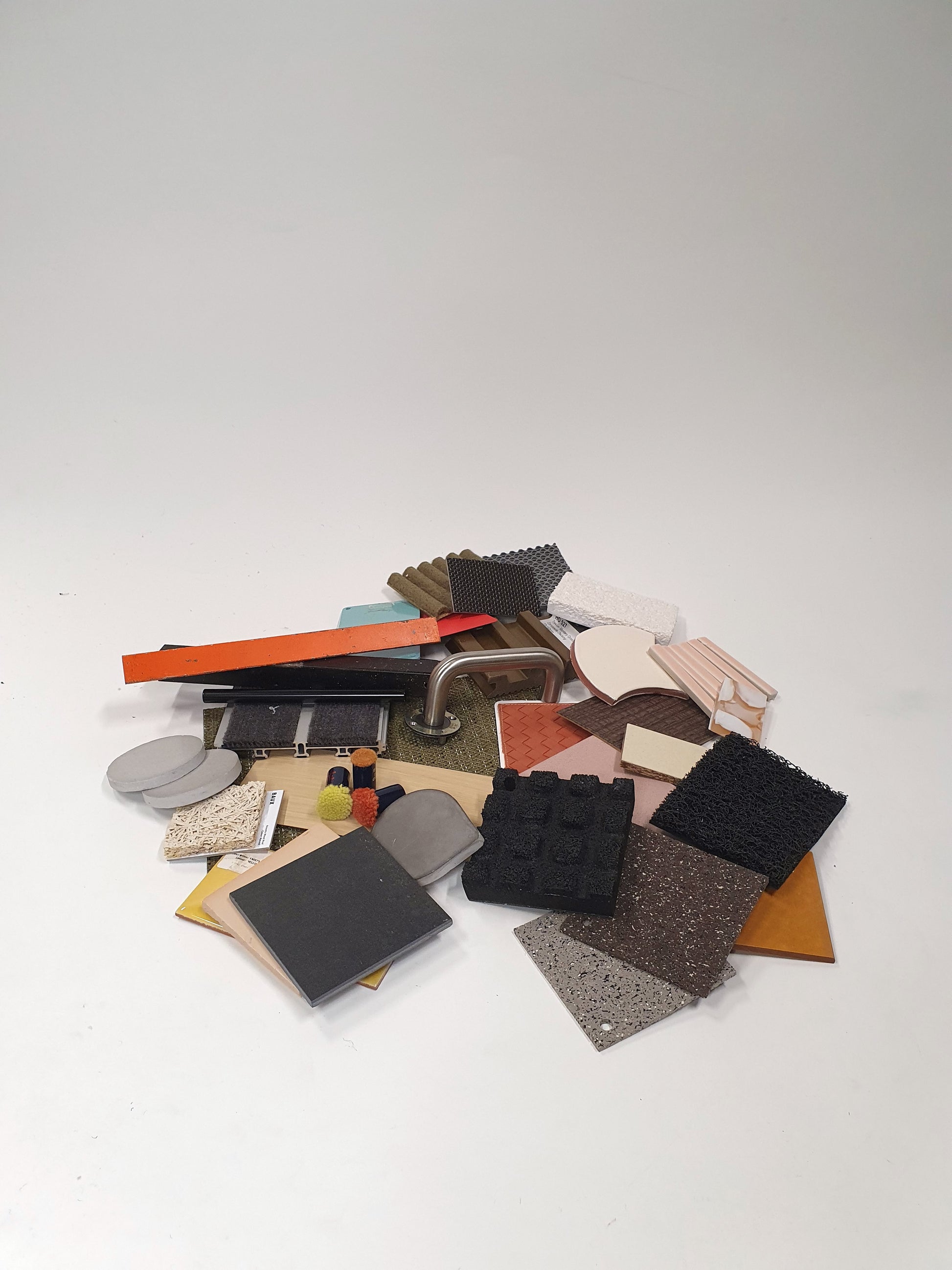 Collection of mixed hard pieces of architectural materials, including woods and metals