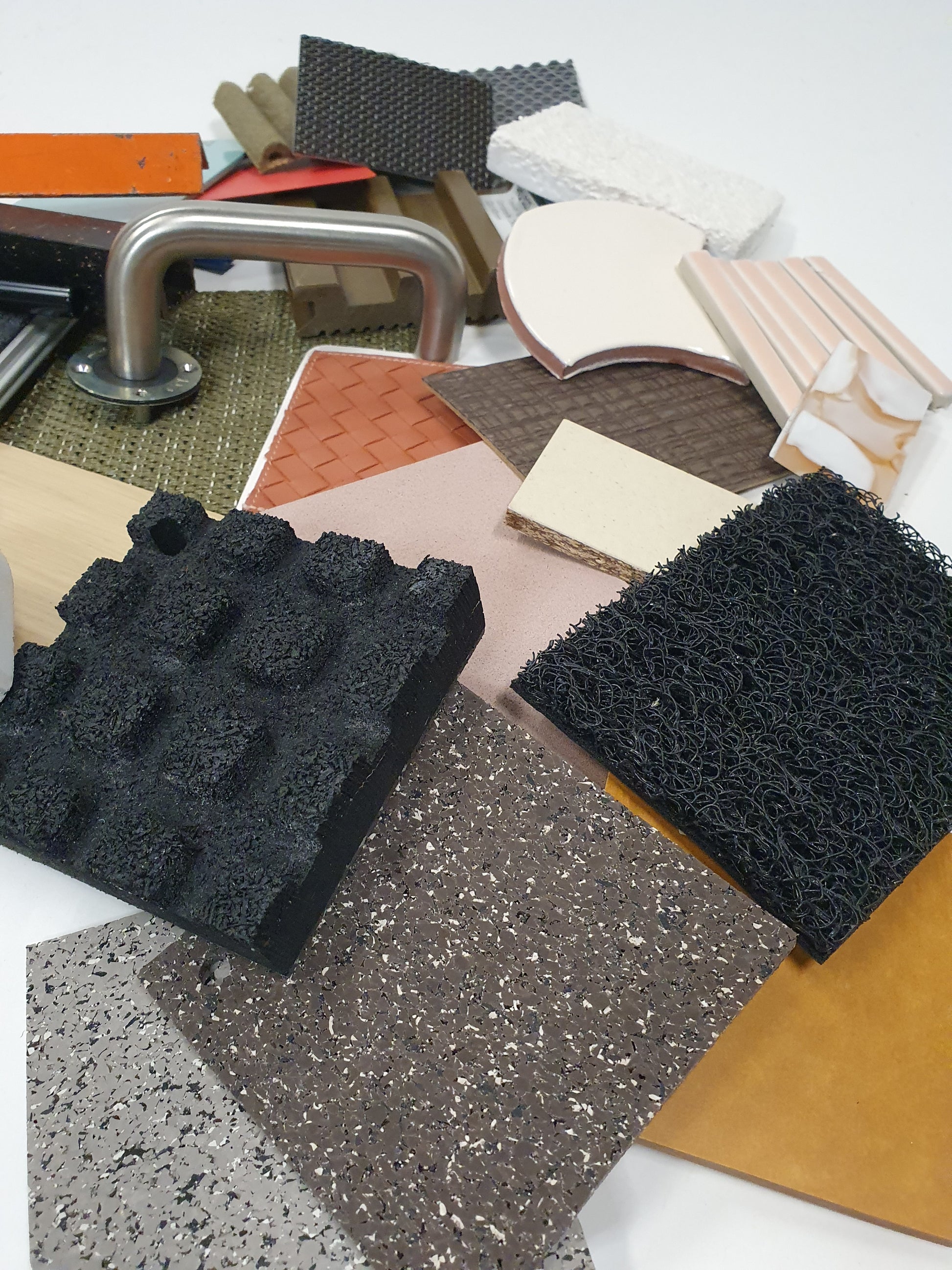 Collection of mixed hard pieces of architectural materials, including woods and metals