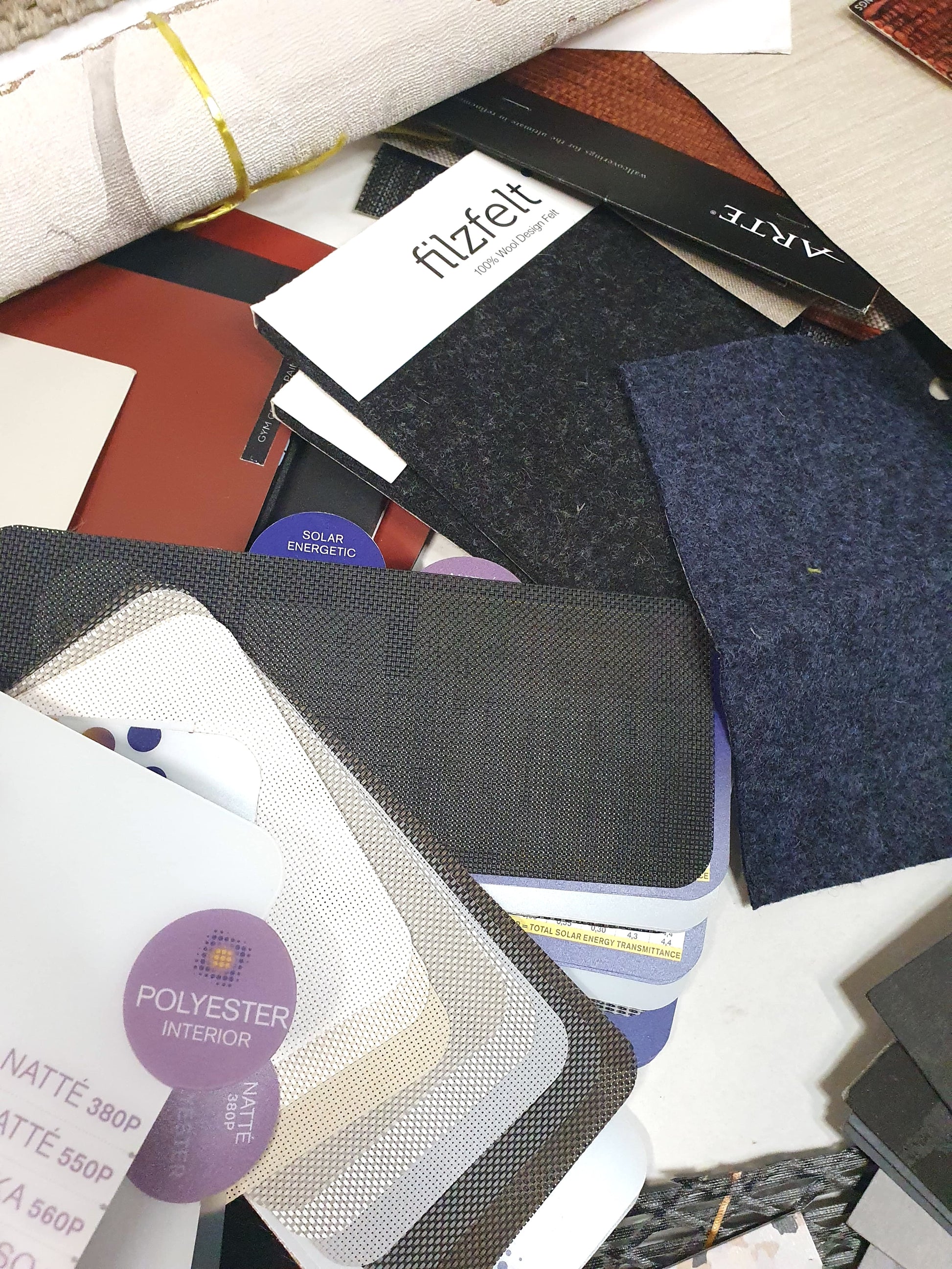 Collection of soft pieces of architectural materials, including fabrics