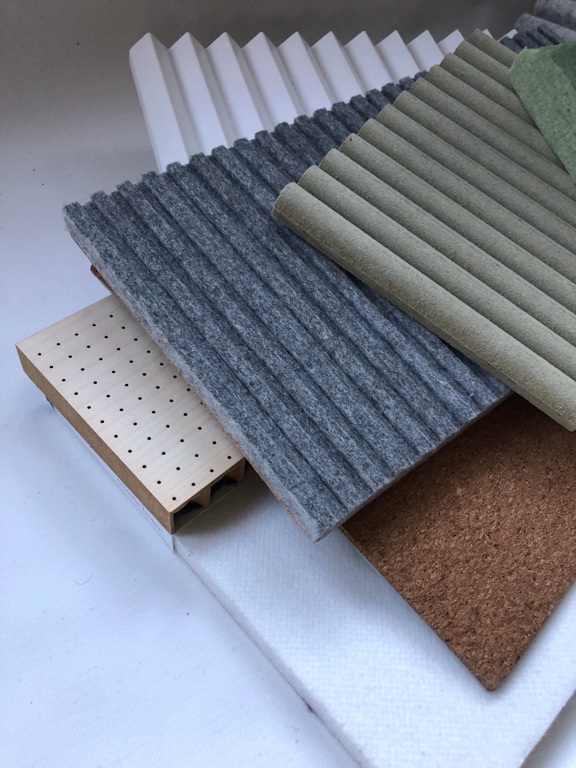 Collection of soft pieces of architectural materials, including fabrics