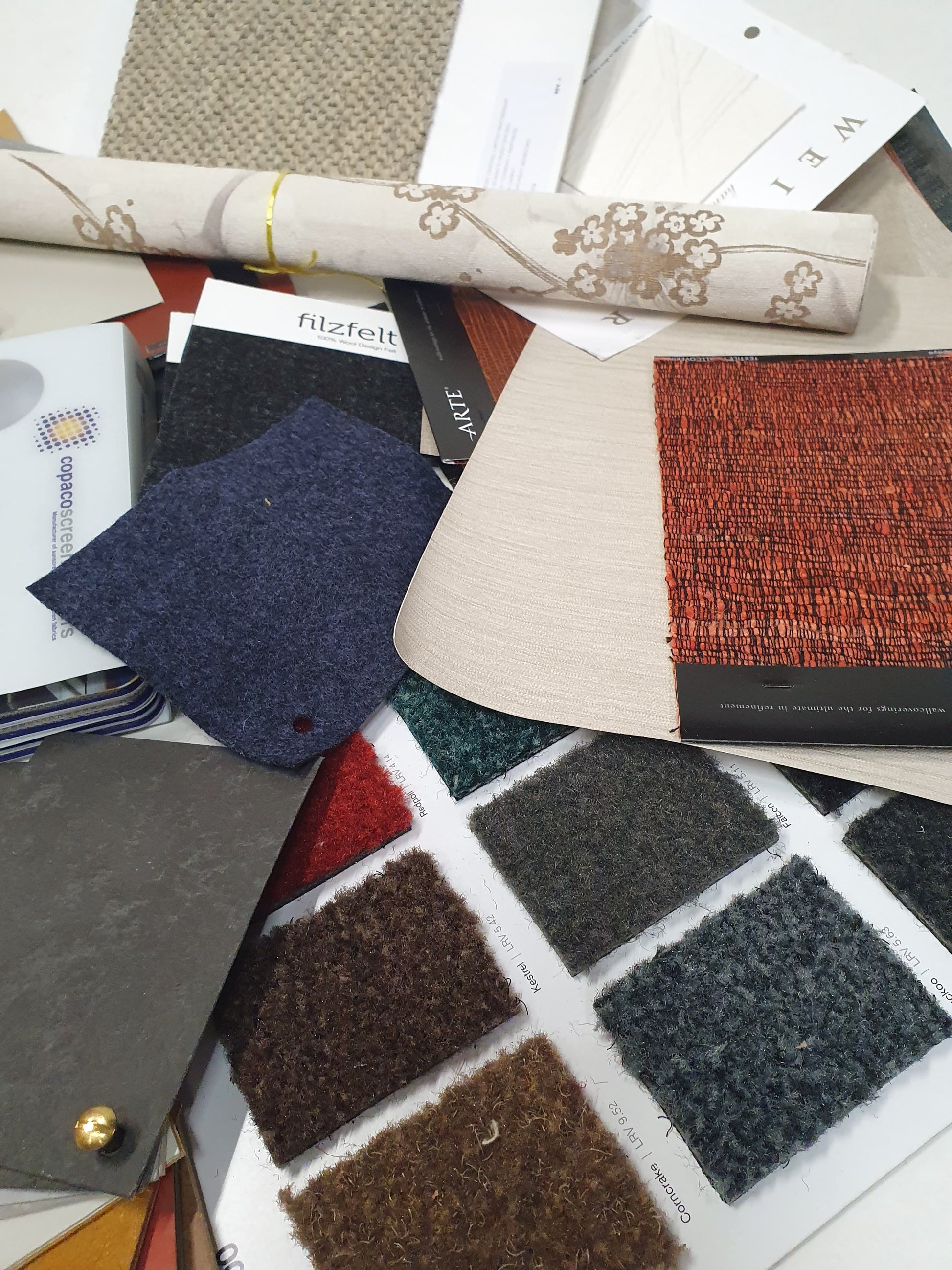 Collection of soft pieces of architectural materials, including fabrics