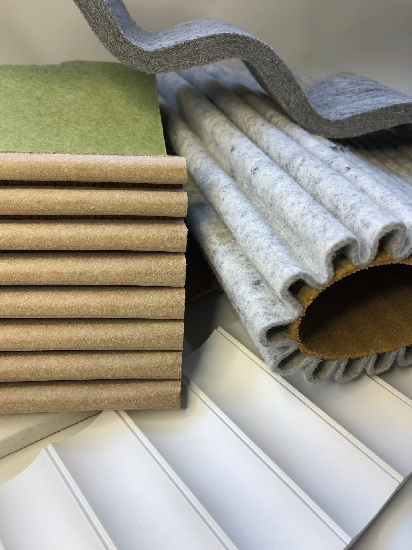 Collection of soft pieces of architectural materials, including fabrics