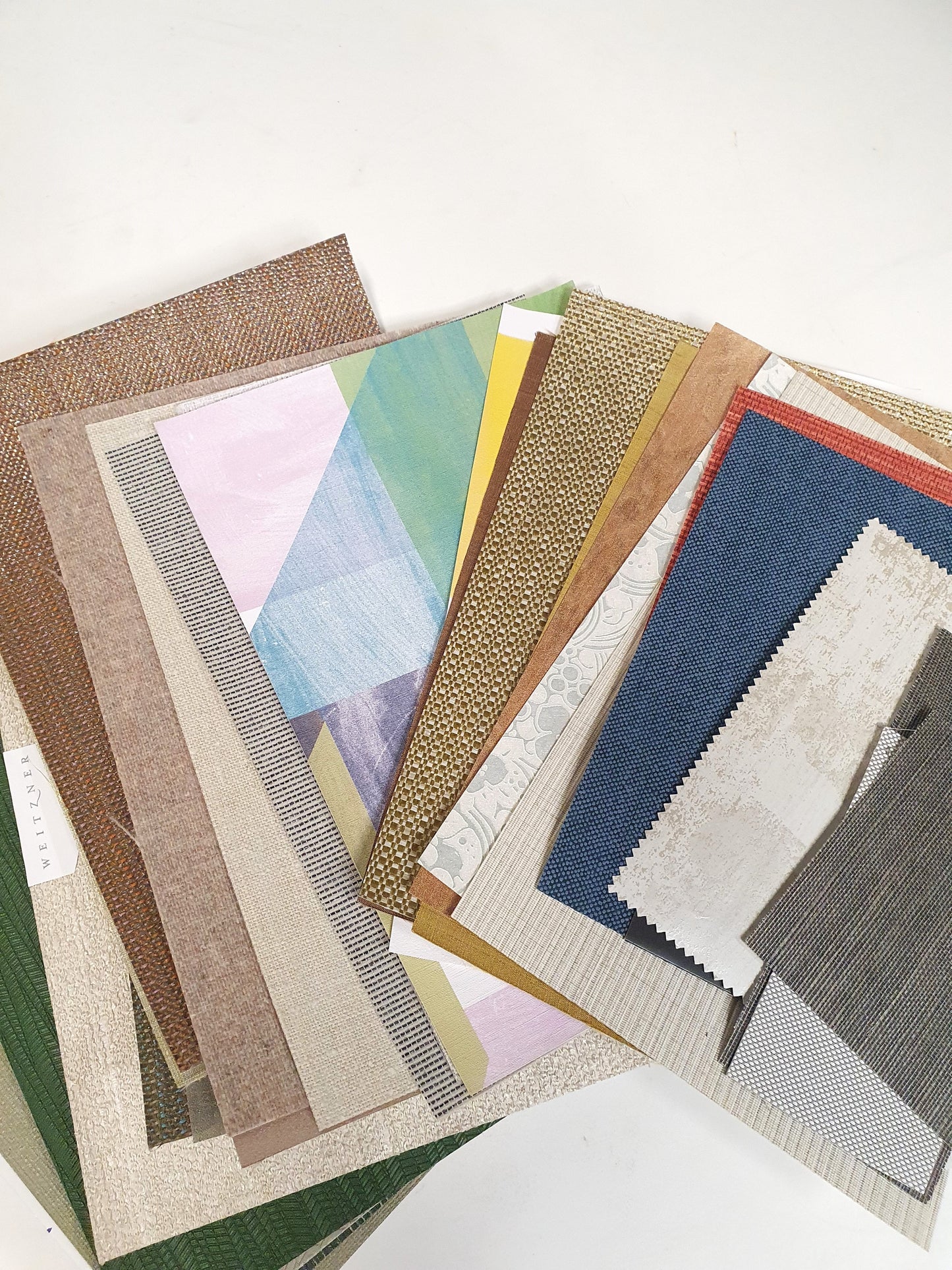 Collection of architectural wallpaper samples in various colours and sizes 